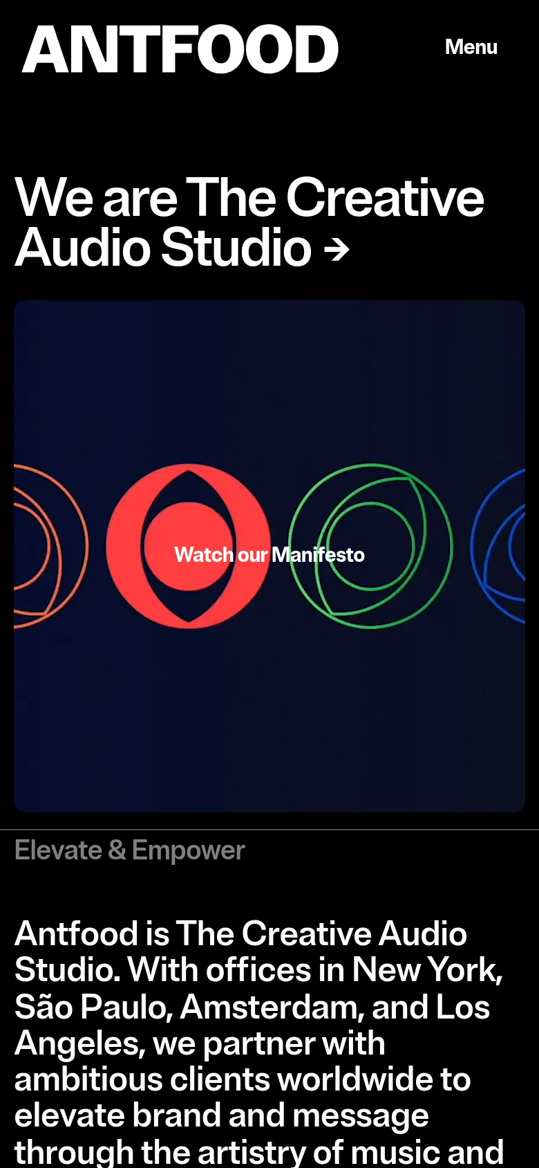 The mobile version uses a vertical layout with the 'ANTFOOD' logo and a 'Menu' button at the top. The hero headline is centered above a video player showing colorful abstract circular graphics and a 'Watch our Manifesto' call to action. The content below is stacked vertically, focusing on the 'Elevate & Empower' text section.
