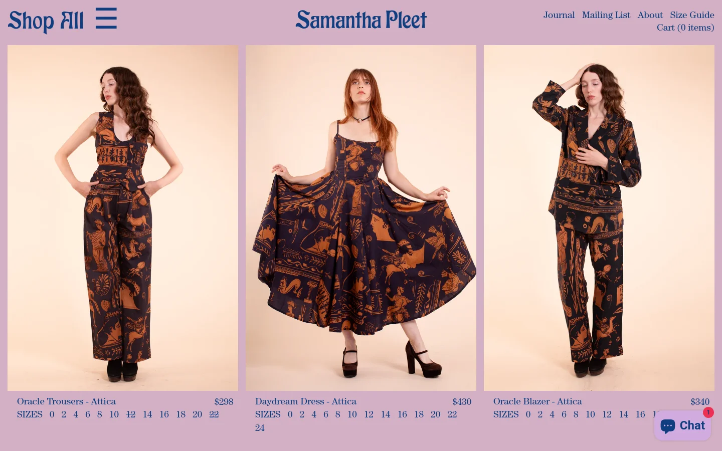 The desktop version of the Shop All page features a minimalist design with a light pink background and a three-column grid layout. Each column displays a large product photograph of a model wearing patterned clothing, followed by the product name, price, and available sizes. The header includes the brand name 'Samantha Pleet' in a stylized font, a 'Shop All' heading, and navigation links for Journal, Mailing List, About, Size Guide, and Cart.