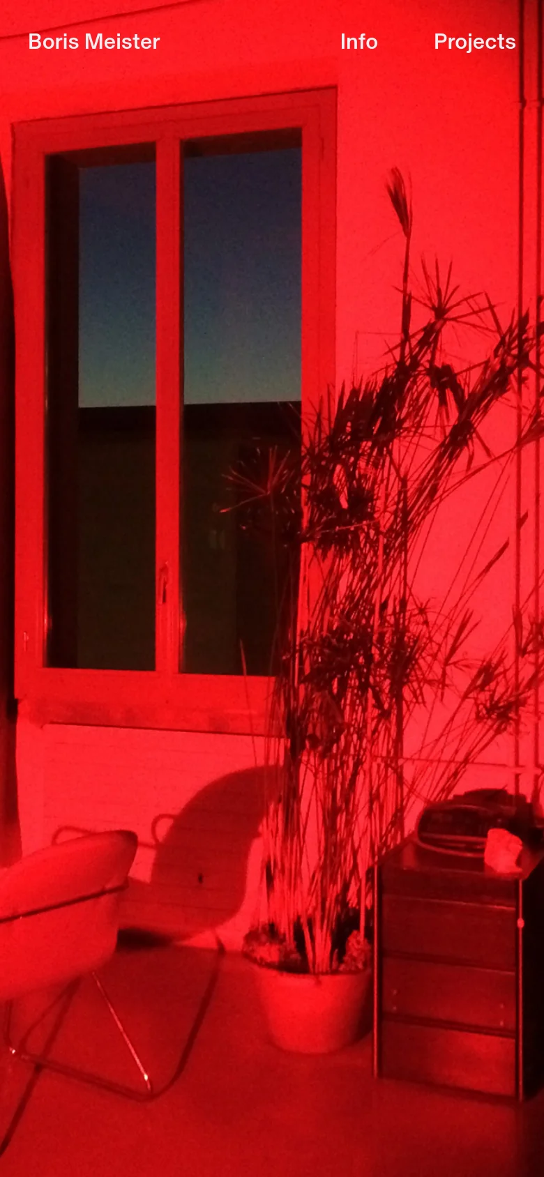 The mobile version maintains the same intense red-lit room background but uses a vertical orientation. The navigation is rearranged with 'Boris Meister' positioned at the top left, and 'Info' and 'Projects' stacked or placed at the top right to accommodate the narrower screen width.