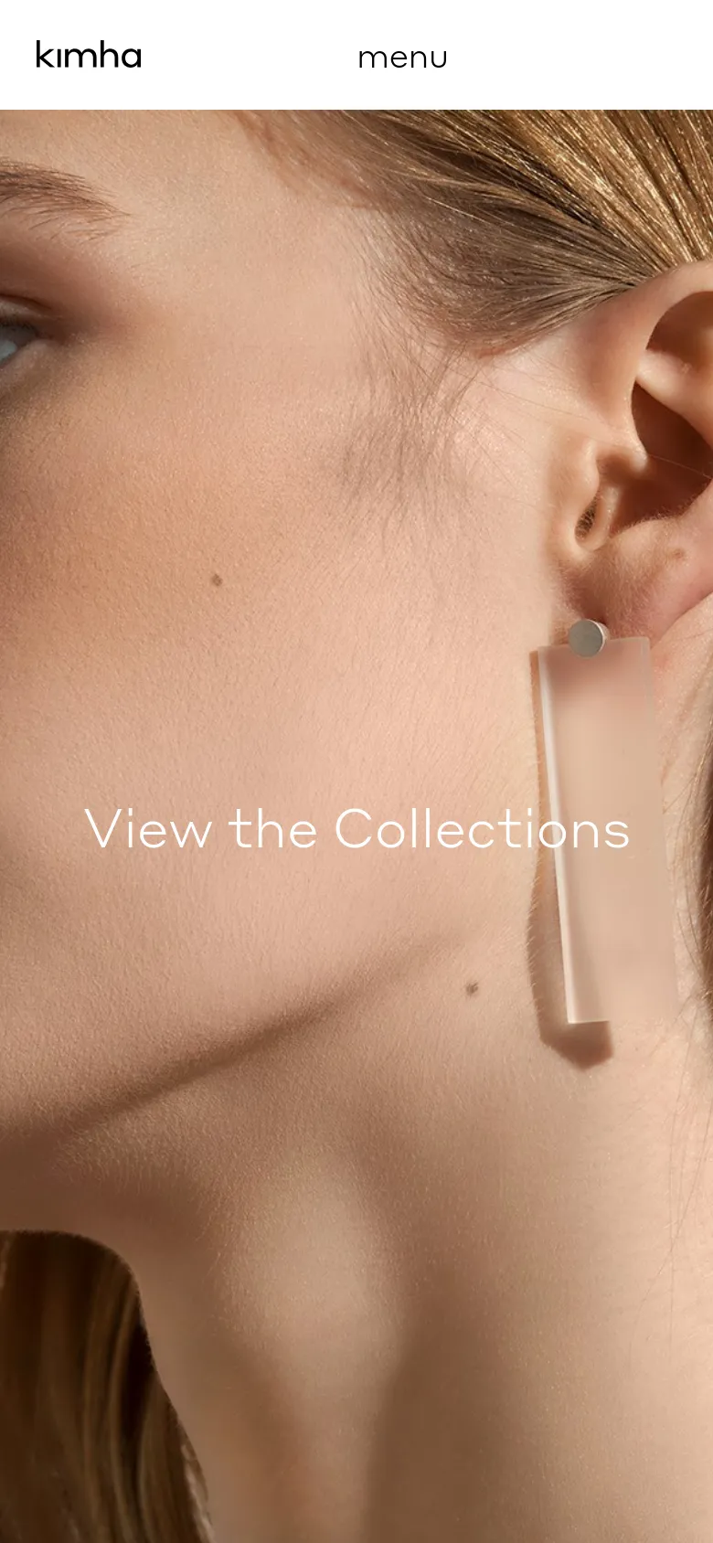The mobile version simplifies the layout, replacing the top navigation bar with a centered 'kimha' logo and a 'menu' button. The large hero image of the woman's profile remains the focal point, with the 'View the Collections' call to action overlaid prominently in the center of the screen.