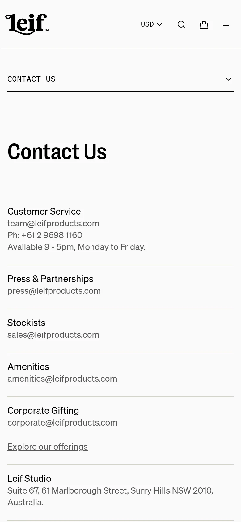The mobile version presents a simplified, single-column vertical layout optimized for scrolling. The large hero image is removed, focusing entirely on the contact information and links, such as Customer Service and Corporate Gifting, which are stacked vertically under a large 'Contact Us' heading. The top navigation is condensed into a hamburger menu and a search icon.