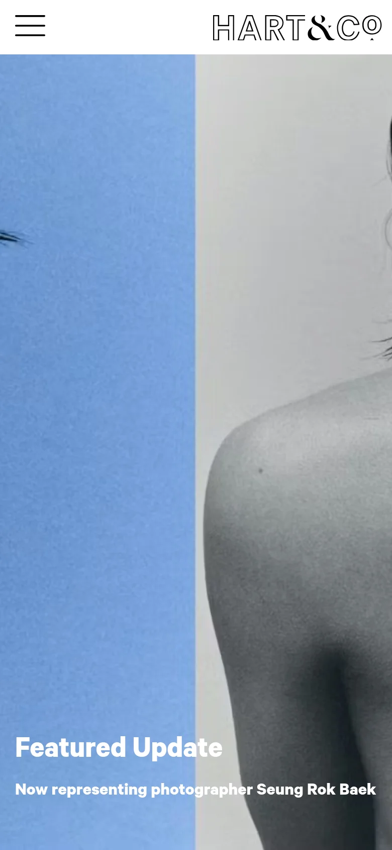 The mobile version presents a single-column layout with the 'HART & CO' logo and a hamburger menu icon at the top. The hero section features the same split imagery but is cropped to focus on the person's back and the 'Featured Update' text, which reads 'Now representing photographer Seung Rok Baek' in white over the image.