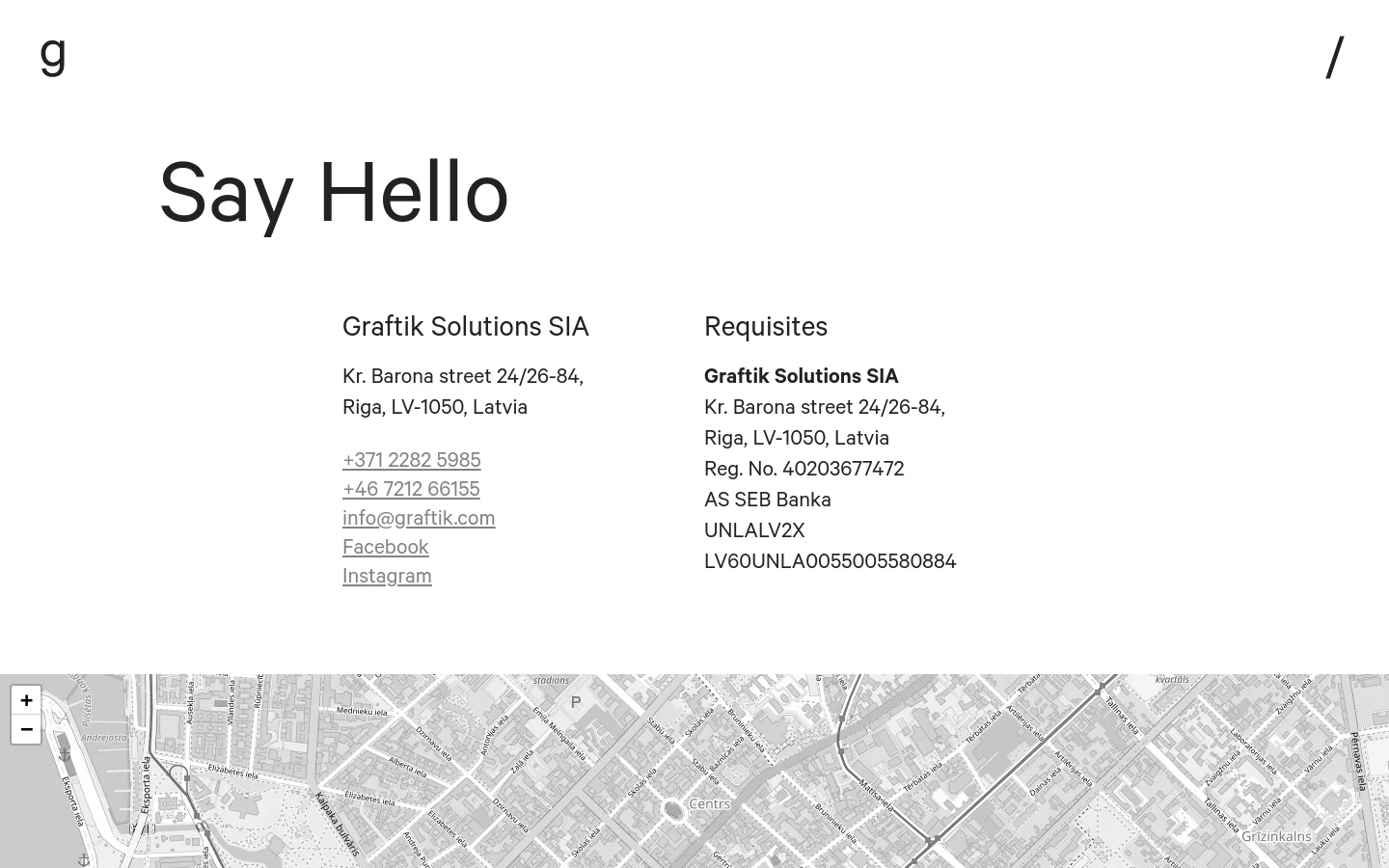 The contact page features a minimalist white background with large black typography. The layout is split into two columns under the headline 'Say Hello', displaying contact details for Graftik Solutions SIA on the left and company requisites on the right, followed by a full-width street map at the bottom.