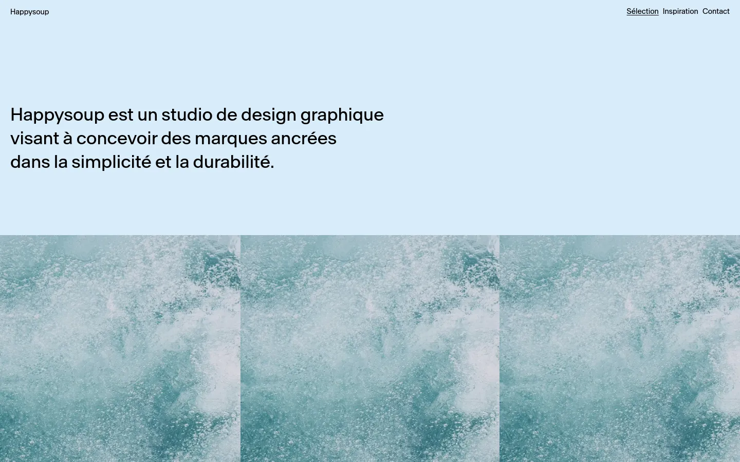 The desktop homepage features a minimalist light blue background with a large black headline stating the studio's mission. Below the text is a wide, textured teal and white abstract image resembling water or bubbles, and a navigation menu is located at the top right.