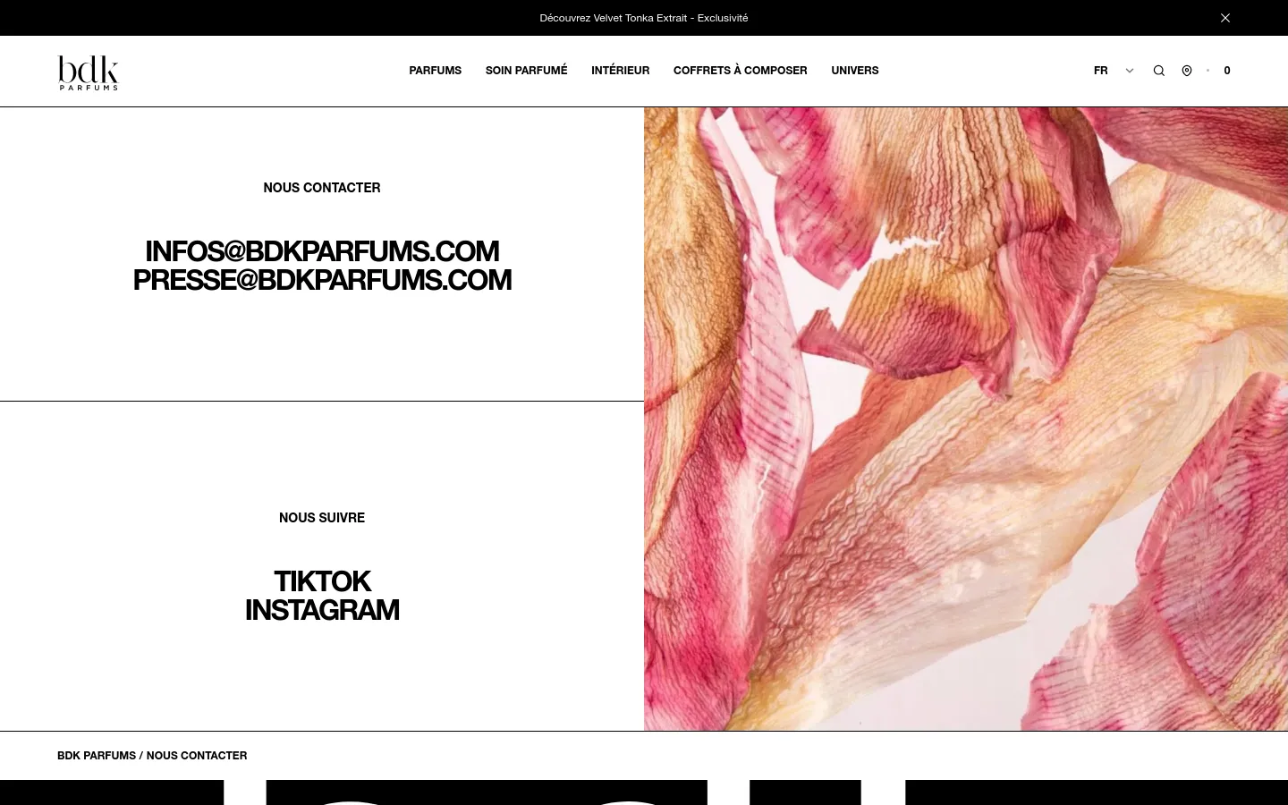 The desktop contact page features a minimalist white layout with large, bold black typography for contact emails and social media links. A large vertical hero image of textured pink and orange flower petals occupies the right half of the screen. The navigation bar at the top includes the BDK Parfums logo and links for Parfums, Soin Parfumé, Intérieur, Coffrets à Composer, and Univers.