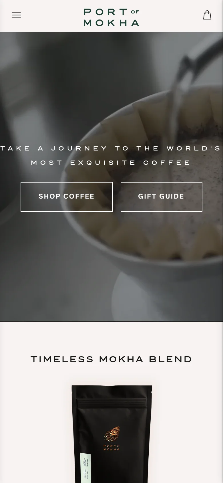 The mobile version presents a vertically oriented hero image showing a close-up of coffee being poured, overlaid with the same central headline and two large, stacked buttons for 'SHOP COFFEE' and 'GIFT GUIDE'. The header uses a hamburger menu icon on the left, the brand logo in the center, and a shopping bag icon on the right. The layout transitions to a single-column view for product sections like 'TIMELESS MOKHA BLEND' below the hero.