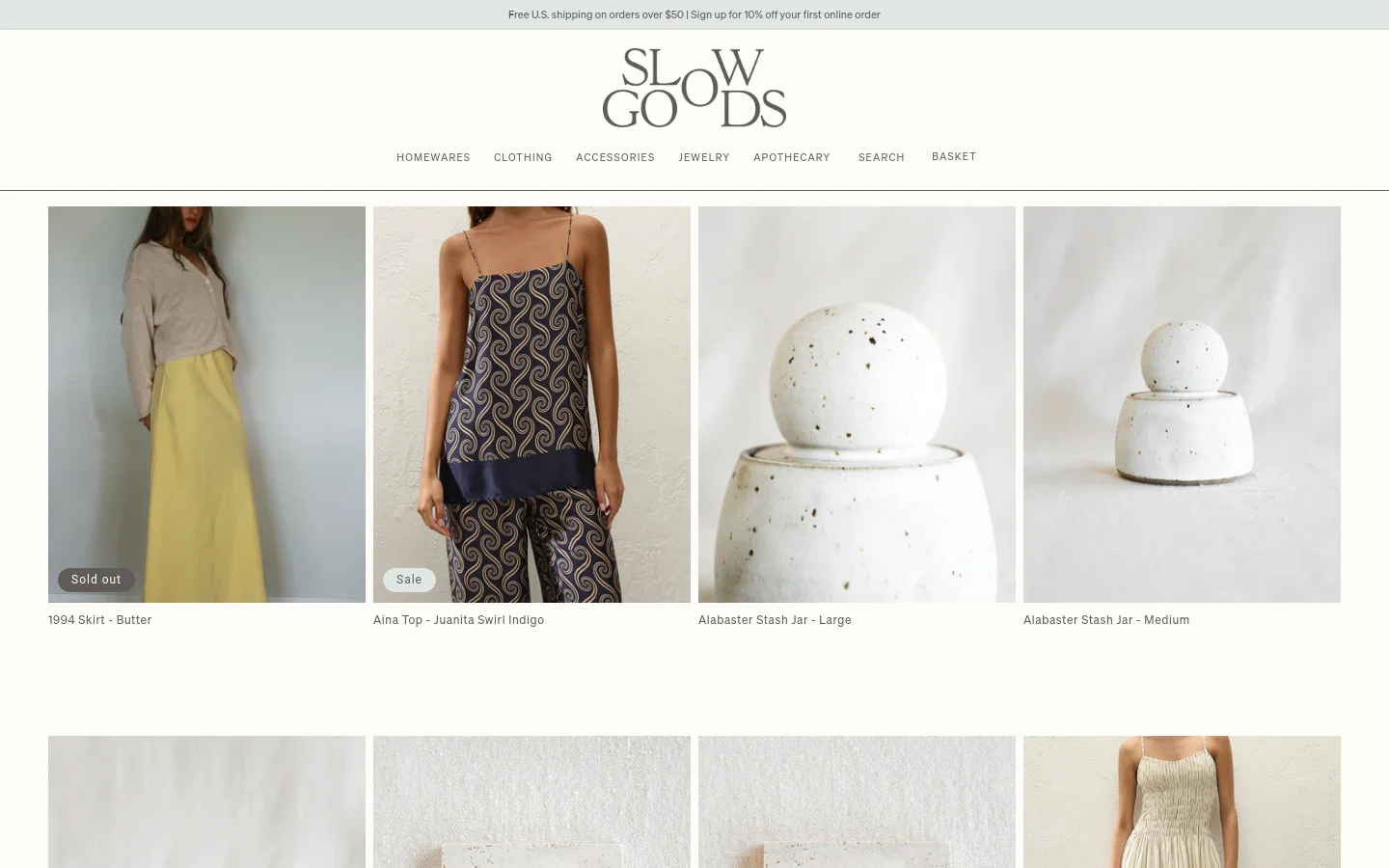 The desktop version of the 'Shop All' page features a clean, minimalist layout with a white background and a centered logo at the top. A navigation menu includes categories like Homewares, Clothing, and Accessories, followed by a grid of product images showcasing items like skirts, tops, and ceramic jars. Each product image is paired with its title and price below.