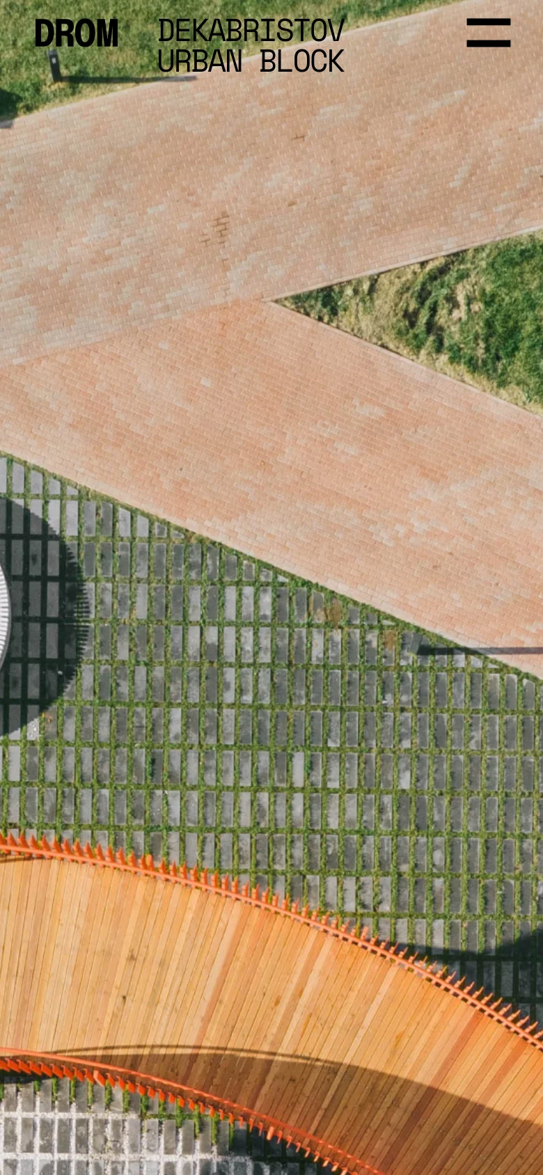 The mobile version displays the same aerial urban landscape but uses a condensed layout with a hamburger menu icon in the top right. The brand name 'DROM' and the project title 'DEKABRISTOV URBAN BLOCK' are prominently positioned in the upper left corner over the image.