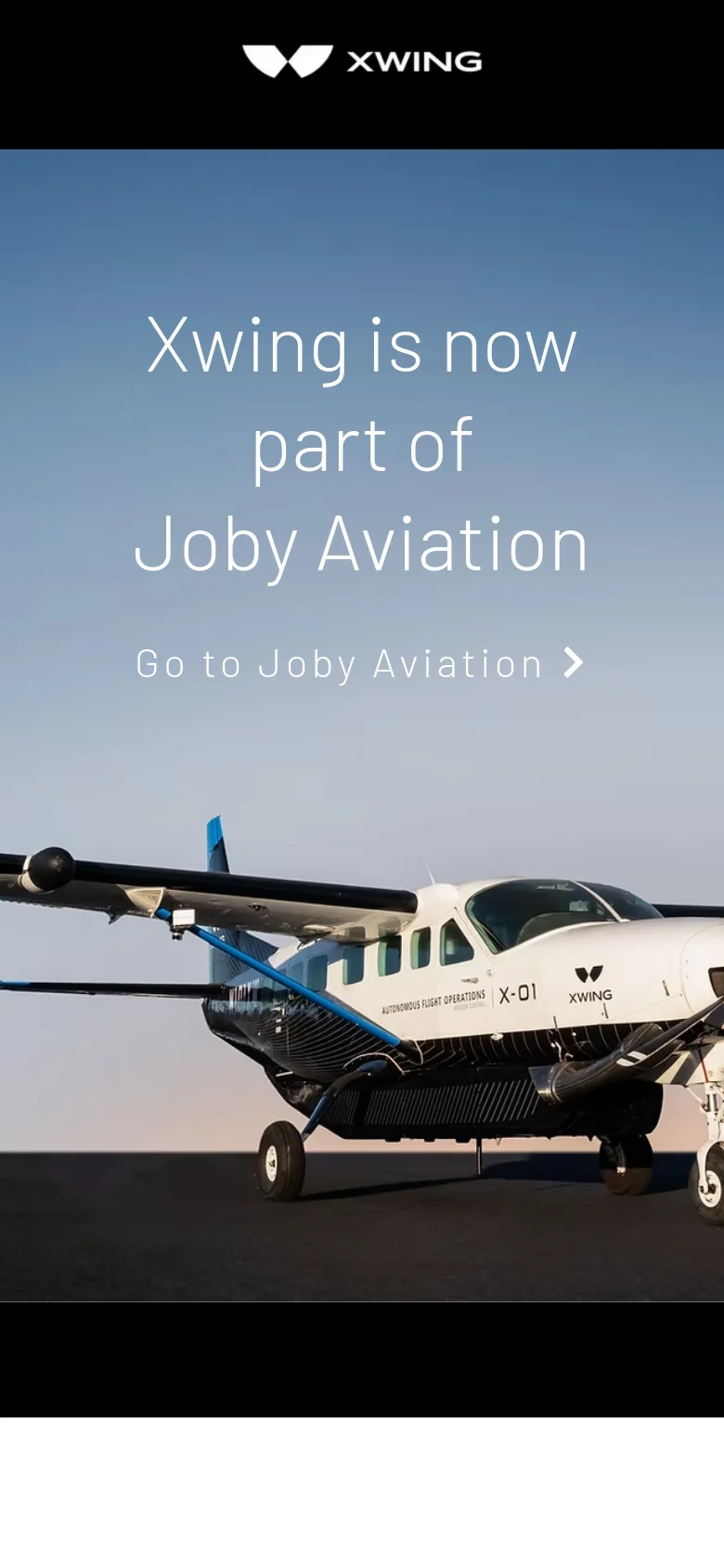The mobile version displays a vertically oriented version of the hero image showing the Xwing aircraft and a blue sky. The headline 'Xwing is now part of Joby Aviation' and the 'Go to Joby Aviation' link are stacked vertically in the center of the screen. The layout is simplified for a narrow screen, focusing on the central text and the aircraft imagery.