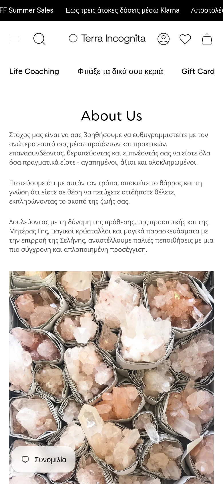 The mobile version presents a single-column vertical layout optimized for small screens. The text and headline are centered, and the large crystal image occupies the full width of the screen at the bottom. The navigation is condensed into a hamburger menu and a search icon, with a floating 'Chat' button visible in the bottom left corner.