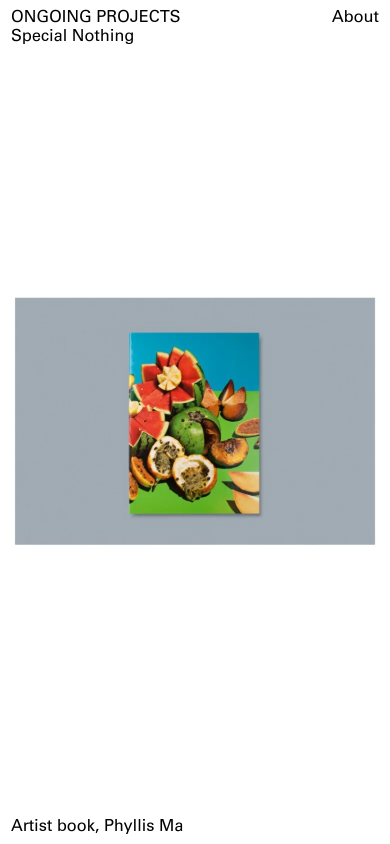 The mobile version maintains the minimalist aesthetic with a light gray background and black text, but uses a single-column layout. The hero image of the fruit-themed book cover is scaled down and centered, with the site title and 'About' link stacked or repositioned for a narrower viewport.