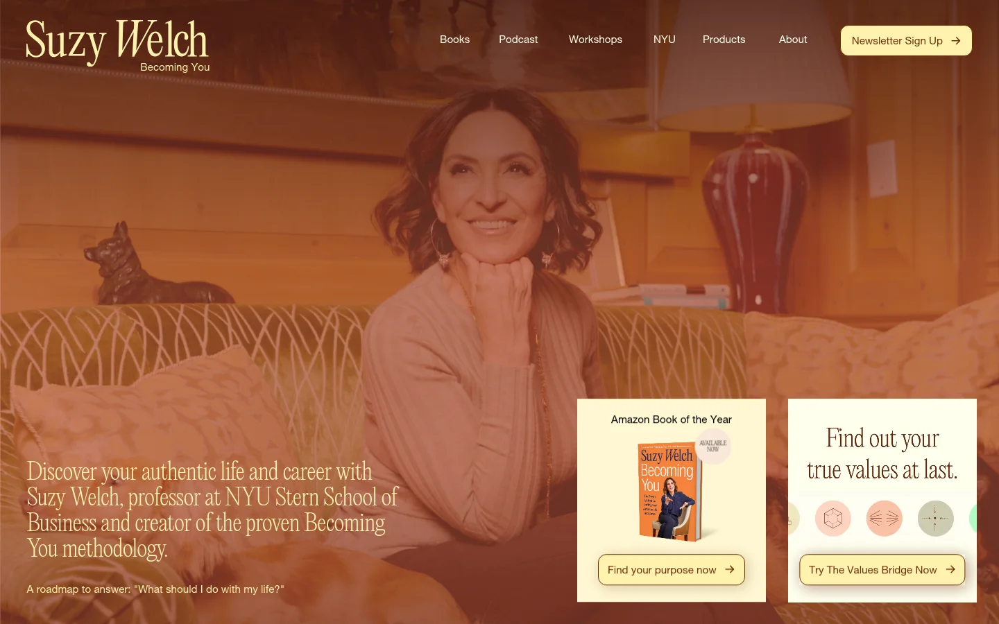 The desktop homepage features a large hero image of Suzy Welch smiling in a warm, indoor setting with a sepia-toned overlay. The layout includes a top navigation bar with links for Books, Podcast, Workshops, NYU, Products, and About, alongside a 'Newsletter Sign Up' button. Two prominent white call-to-action cards overlap the hero image, promoting the 'Becoming You' book and 'The Values Bridge' assessment.