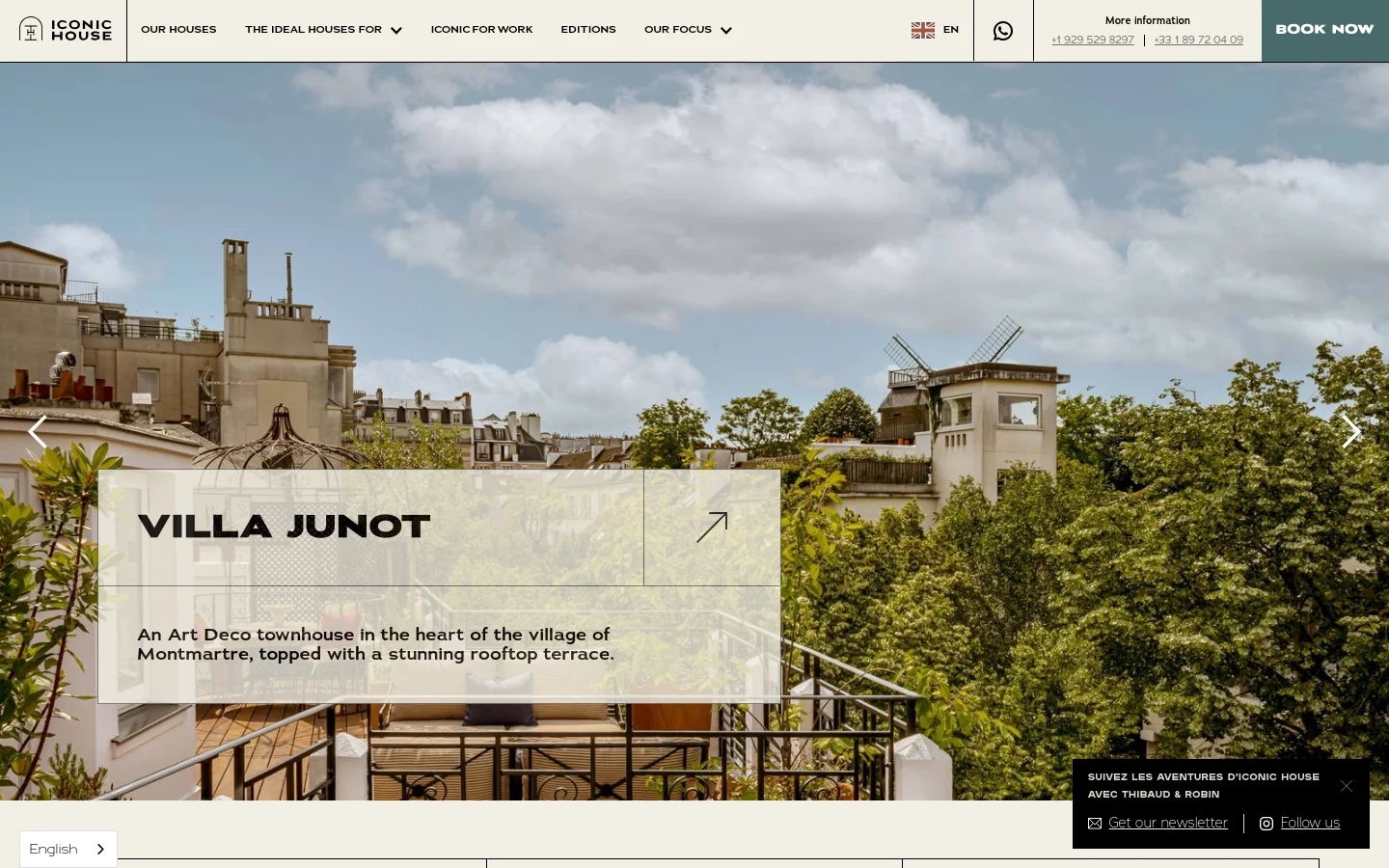 The desktop homepage features a full-width hero image slider showcasing luxury properties, such as Villa Junot, with large navigation arrows. A clean white navigation bar at the top includes the Iconic House logo, menu links like 'Our Houses' and 'Editions', a language selector, and a prominent teal 'BOOK NOW' button. The layout is airy with a minimalist aesthetic and high-quality photography.