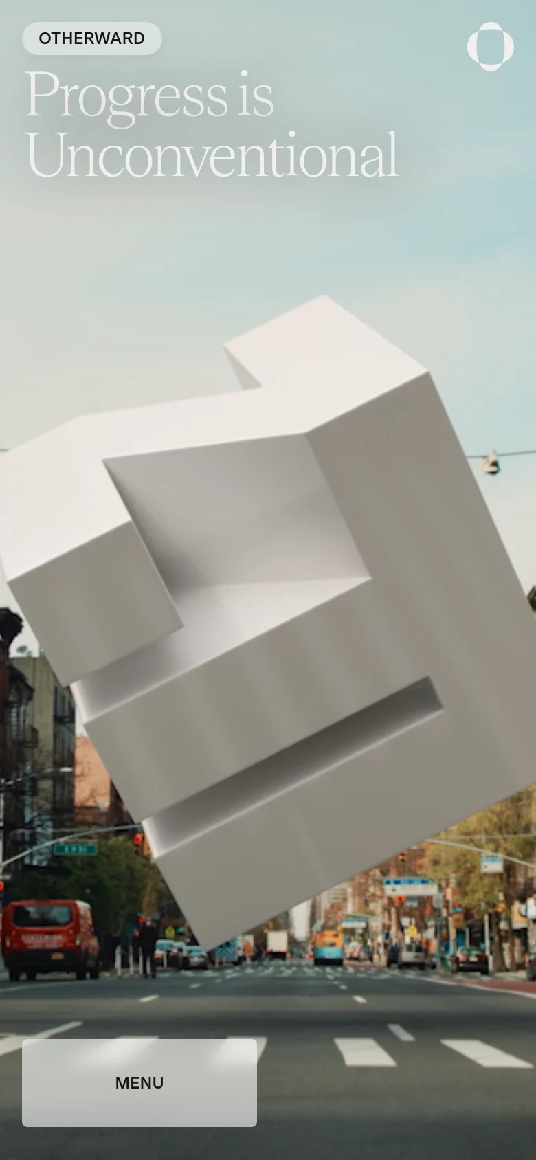 The mobile version shows a vertically oriented view of the same New York City street scene and floating white geometric shape. The headline 'Progress is Unconventional' is stacked vertically, and the 'MENU' button is enlarged and positioned at the bottom left for easier touch access.
