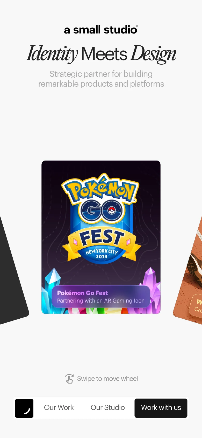 The mobile version presents a vertically stacked layout with the same minimalist aesthetic and centered typography. The headline 'Identity Meets Design' is prominent, followed by a single large, centered project card for Pokémon GO Fest. A bottom navigation bar remains fixed, featuring a dark 'Work with us' call-to-action button and a prompt to 'Swipe to move wheel'.