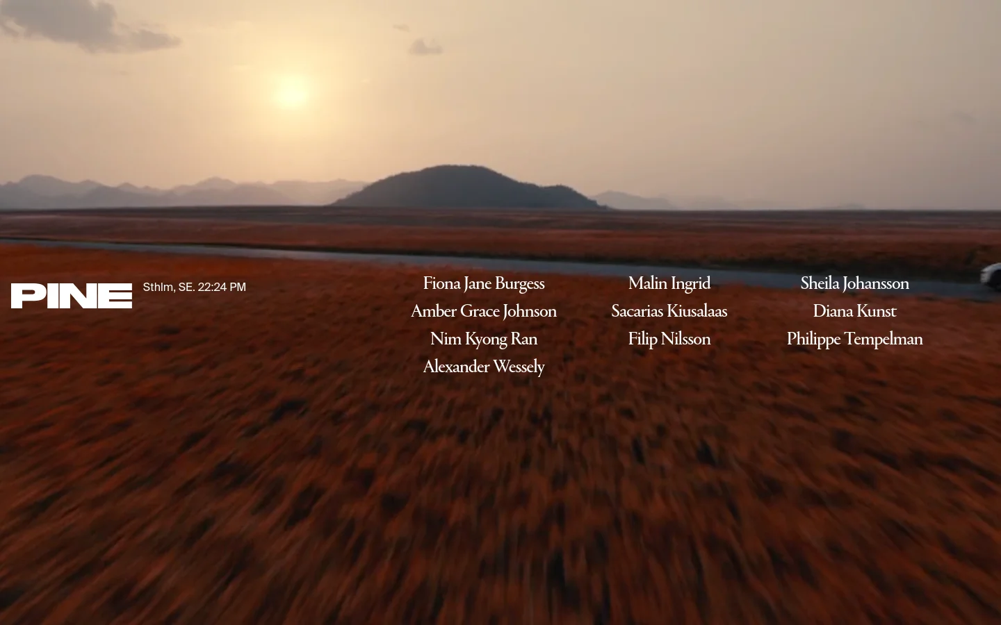 The desktop homepage features a minimalist design with a large, cinematic landscape background of a sunset over a river and hills. The word 'PINE' is prominently displayed in white on the left, while a list of director names is arranged in three columns on the right.