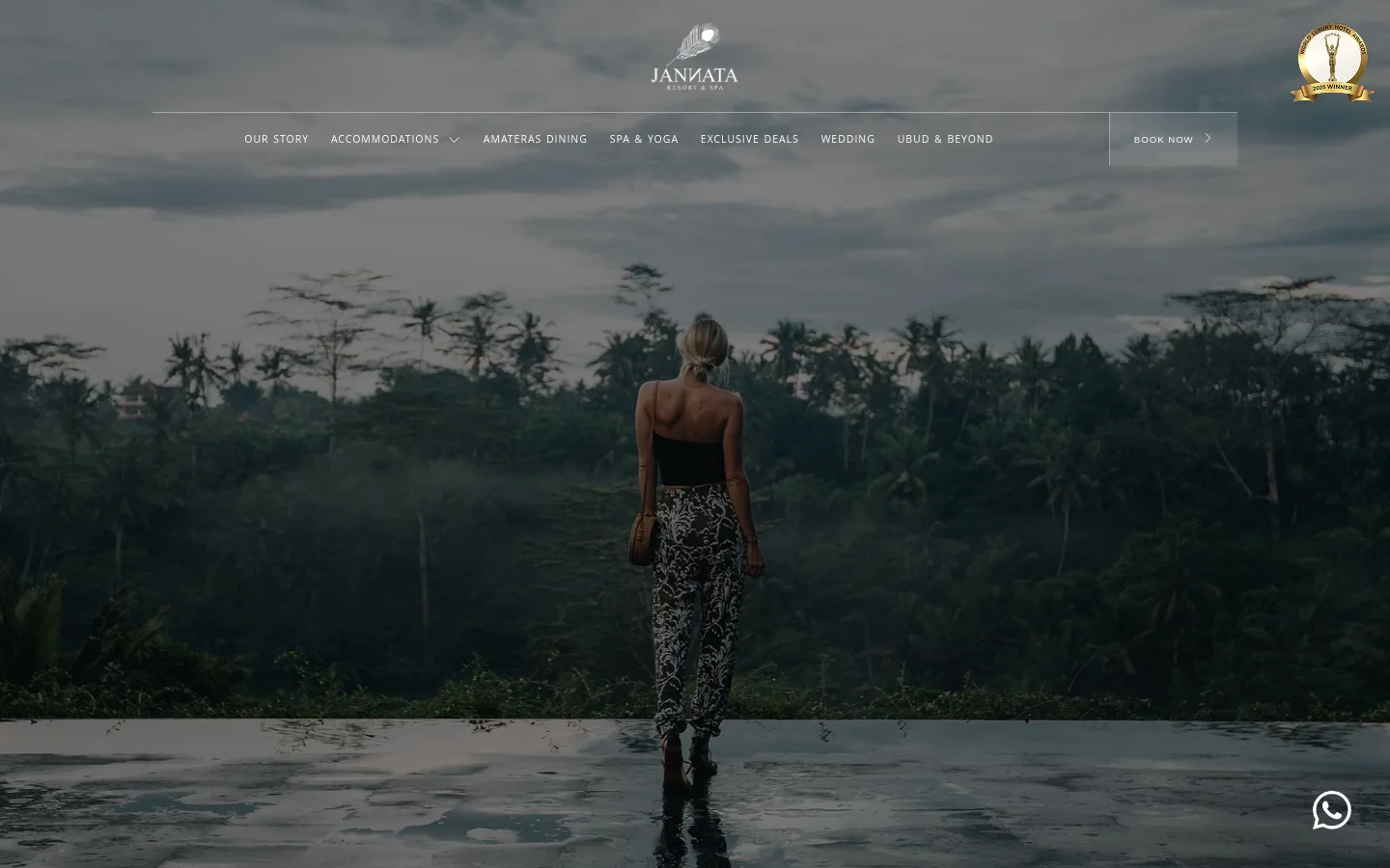 The desktop version features a full-width hero image of a woman looking out over a misty tropical jungle valley at dusk. A white navigation menu sits at the top with links like 'Our Story' and 'Accommodations,' alongside a 'Book Now' button, all overlaid on the dark, atmospheric landscape.