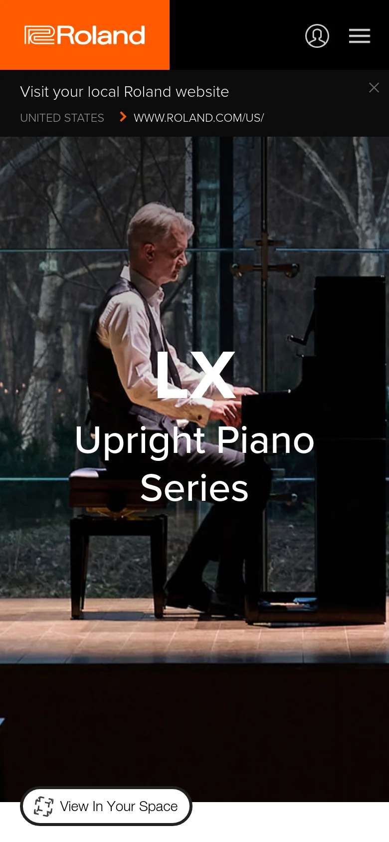 The mobile version shows a vertically oriented hero image of a pianist playing an upright piano in a modern setting. The Roland logo is prominent in an orange header, accompanied by a user profile icon and a hamburger menu icon. The 'View In Your Space' button is centered at the bottom of the screen.