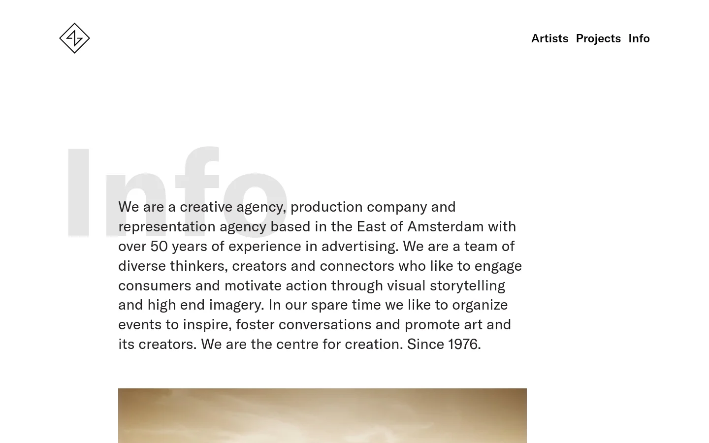 The desktop page features a minimalist design with a white background and a large, light gray 'Info' heading in the background. A text block describes the creative agency, positioned next to the large heading, and a video player is visible below the text. The navigation menu includes 'Artists', 'Projects', and 'Info' in the top right corner.