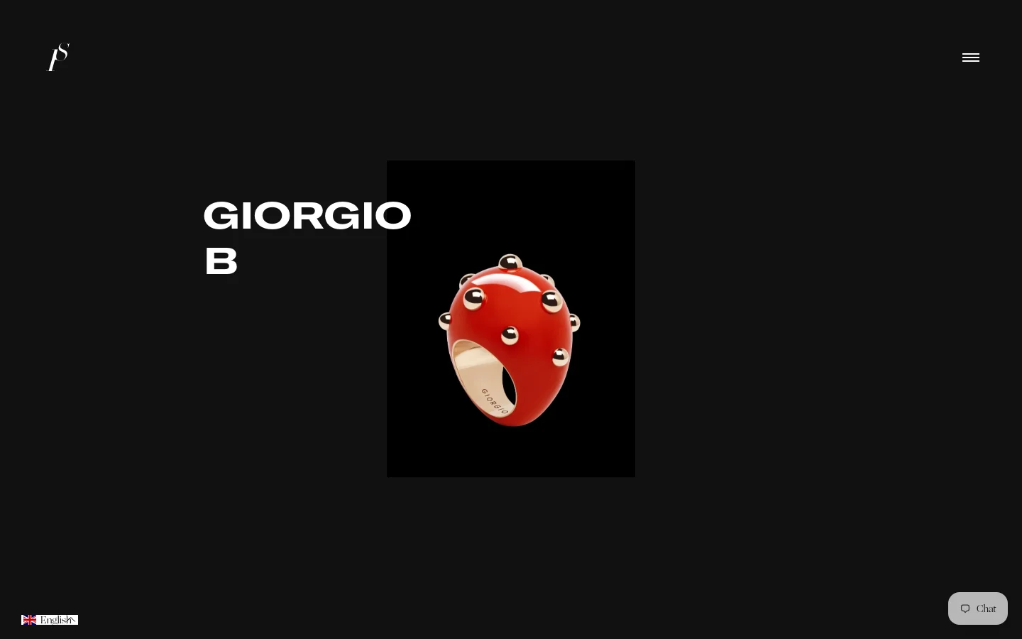 The desktop landing page features a minimalist black background with the large white heading 'GIORGIO B' on the left. To the right, a high-contrast image shows a sculptural, bright red Goccia ring with silver studs set against a black square. A small white logo is in the top left and a hamburger menu icon is in the top right.
