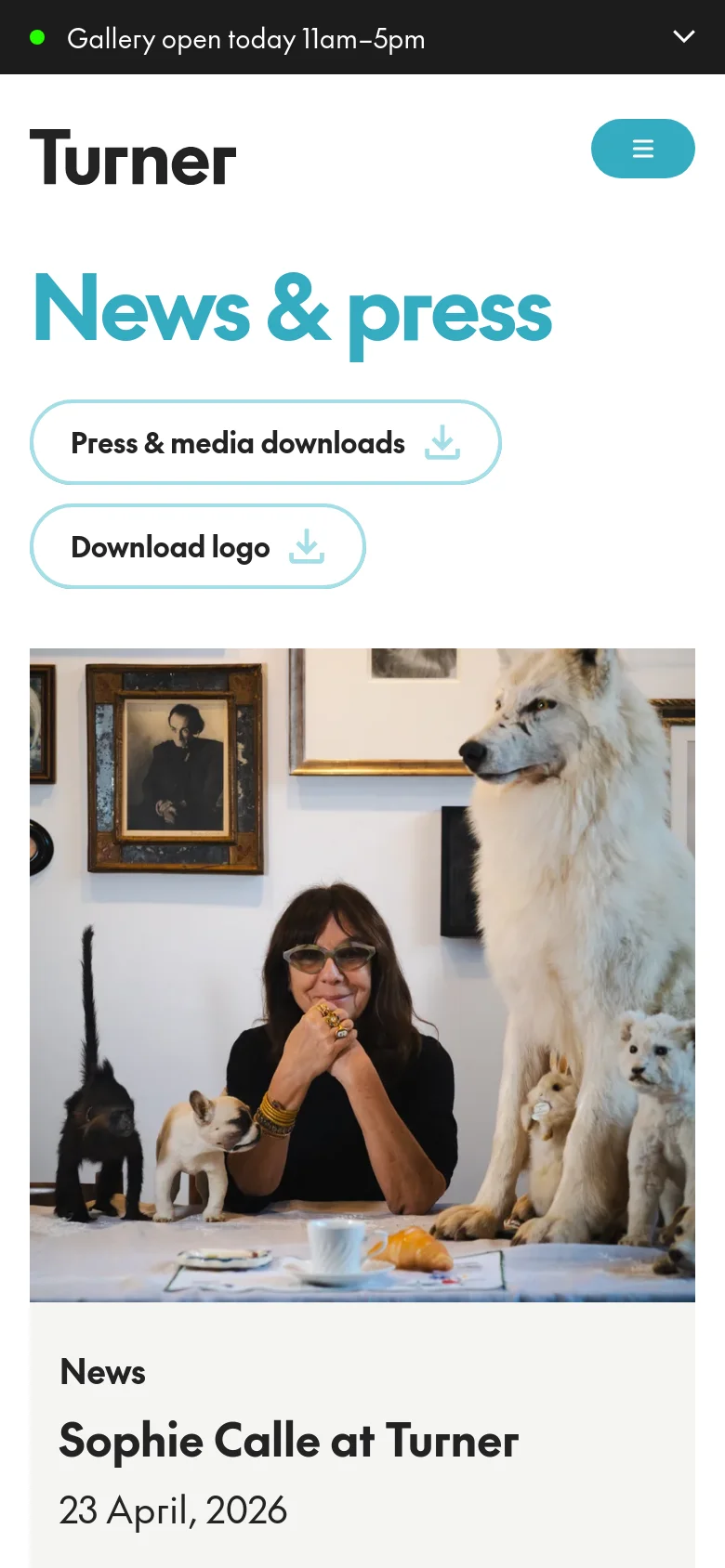 The mobile version simplifies the layout, stacking the 'News & press' headline and download buttons vertically above the main content. The hero image of the woman and the white wolf spans the full width of the screen, followed by the article title and date in a single column format.