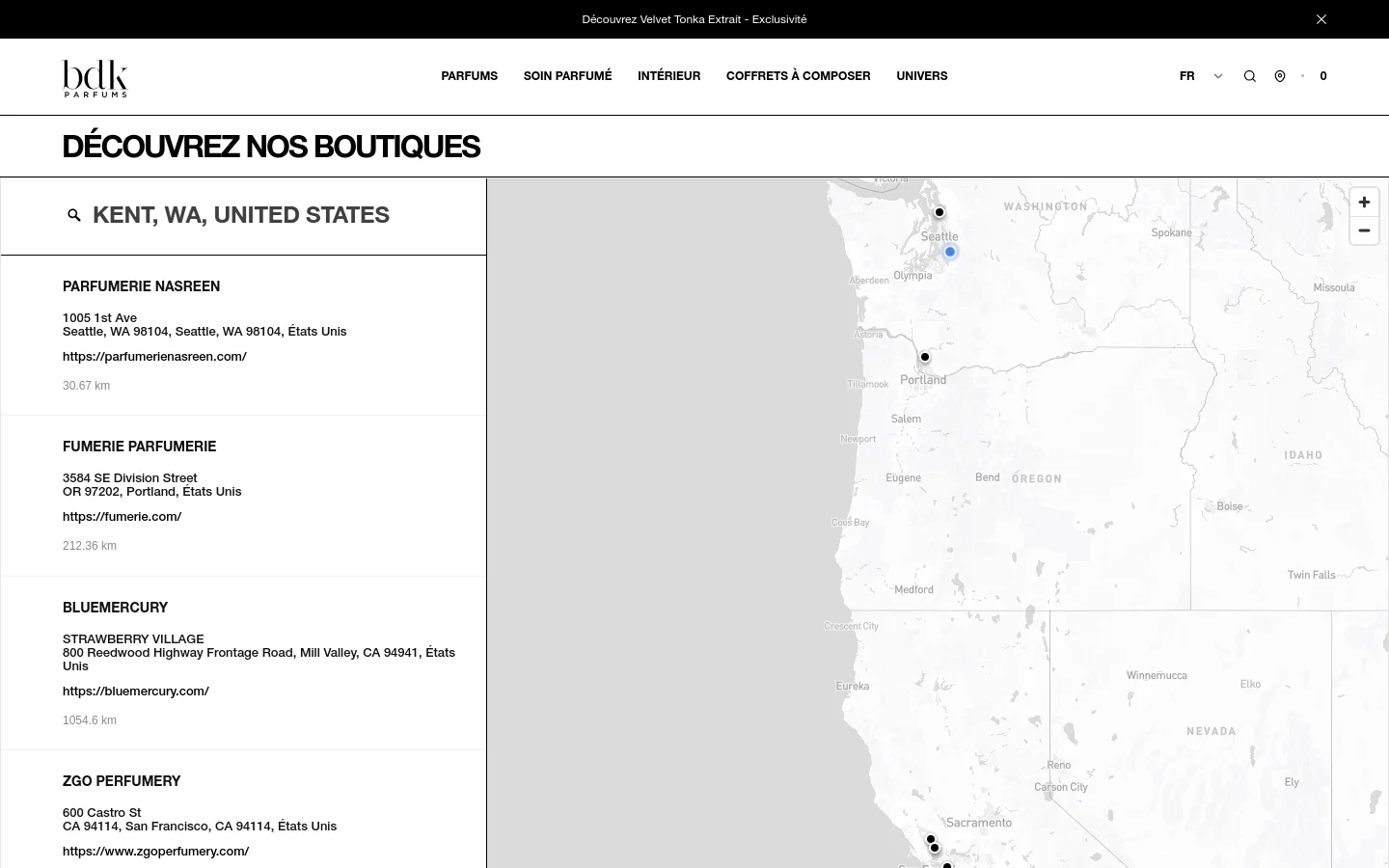 The desktop page features a minimalist white and grey design with a header containing the BDK Parfums logo and navigation menu. A large heading reads 'DÉCOUVREZ NOS BOUTIQUES' above a split-screen layout consisting of a searchable list of boutique names, addresses, and links on the left and an interactive Mapbox map on the right.