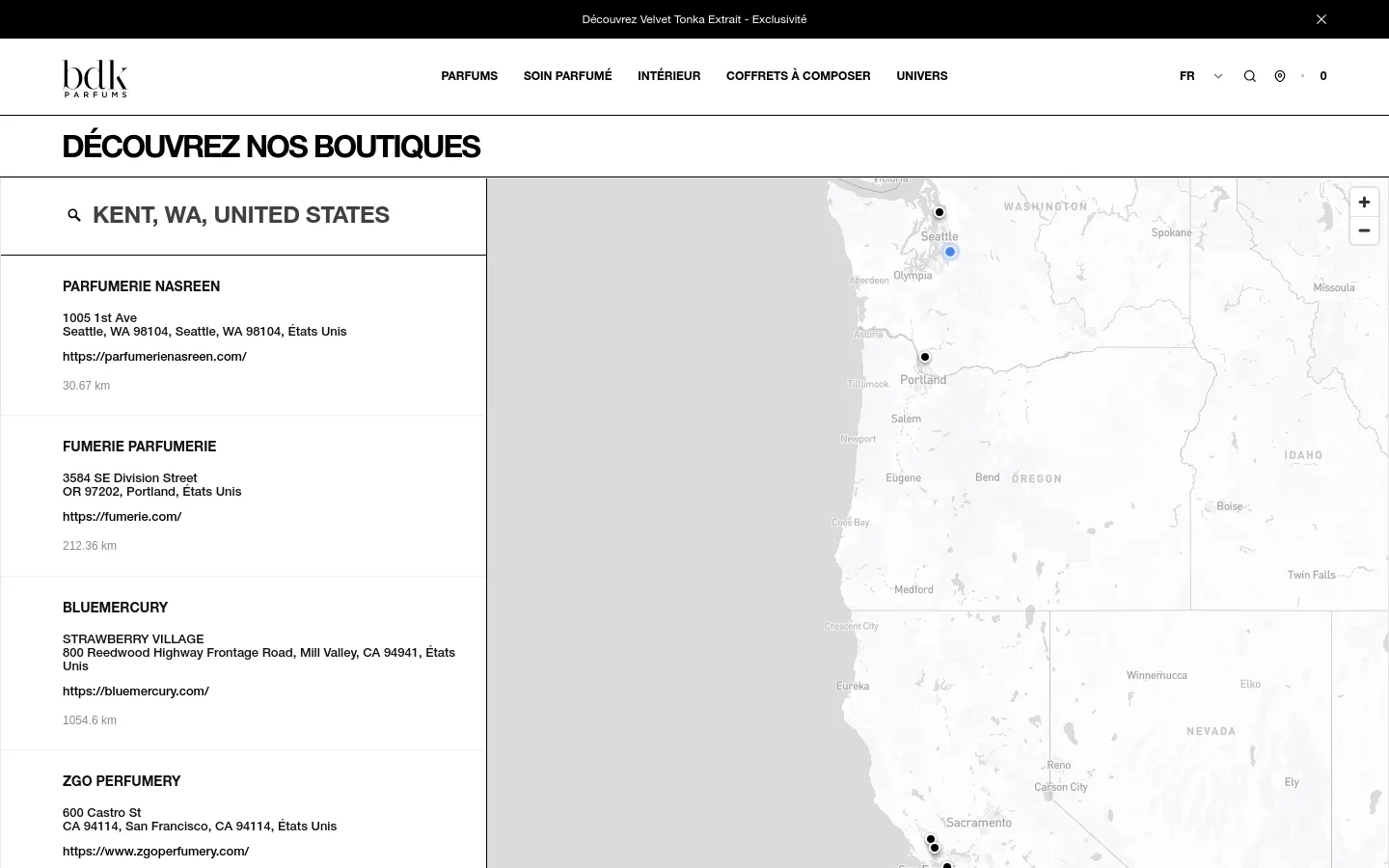The desktop page features a minimalist white and grey design with a header containing the BDK Parfums logo and navigation menu. A large heading reads 'DÉCOUVREZ NOS BOUTIQUES' above a split-screen layout consisting of a searchable list of boutique names, addresses, and links on the left and an interactive Mapbox map on the right.