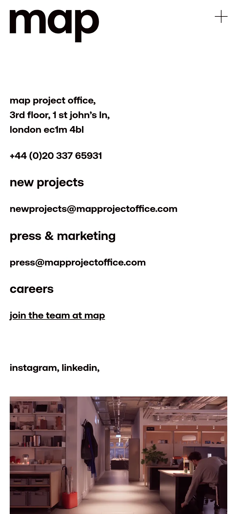The mobile version uses a single-column vertical layout with the 'map' logo and a plus icon at the top. Contact information, email addresses, and career links are stacked vertically in large black text against a white background, with the office interior photograph positioned at the bottom of the screen.