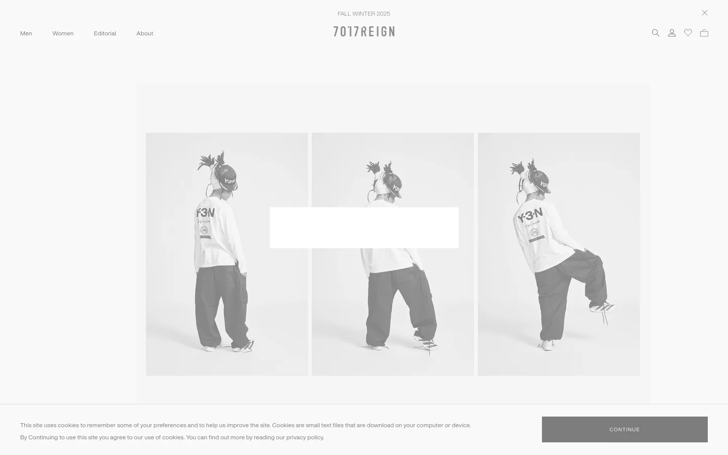 The desktop homepage for 7017 REIGN features a minimalist, high-fashion aesthetic with a light gray background. A large hero image shows a person in Y-3 streetwear in three different poses, centered under the brand logo and 'FALL WINTER 2025' text. A navigation menu is located at the top left, with search, user, favorites, and cart icons on the top right.