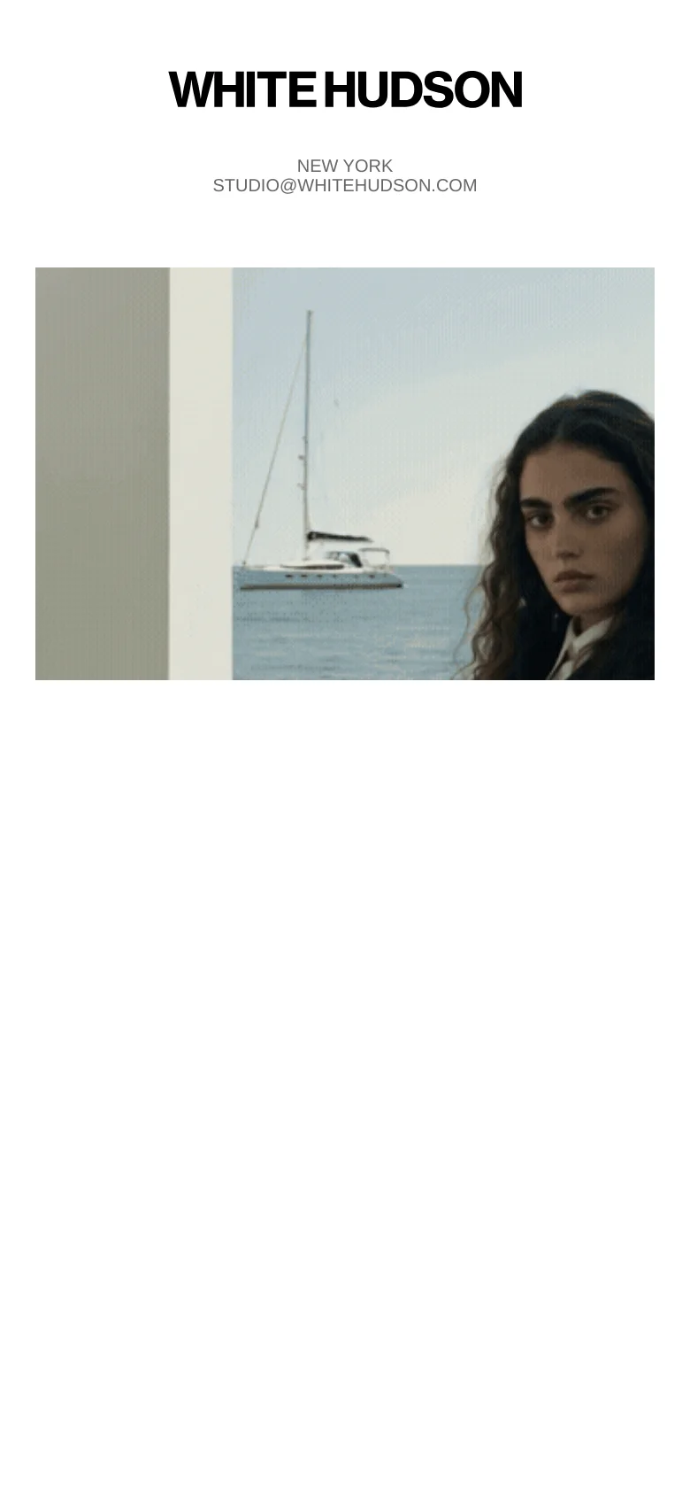 The mobile version uses a vertical layout with the 'WHITE HUDSON' branding and contact information centered at the top. Below the text, a large, square-cropped version of the hero image shows a close-up of the woman and the sailboat against the sea.