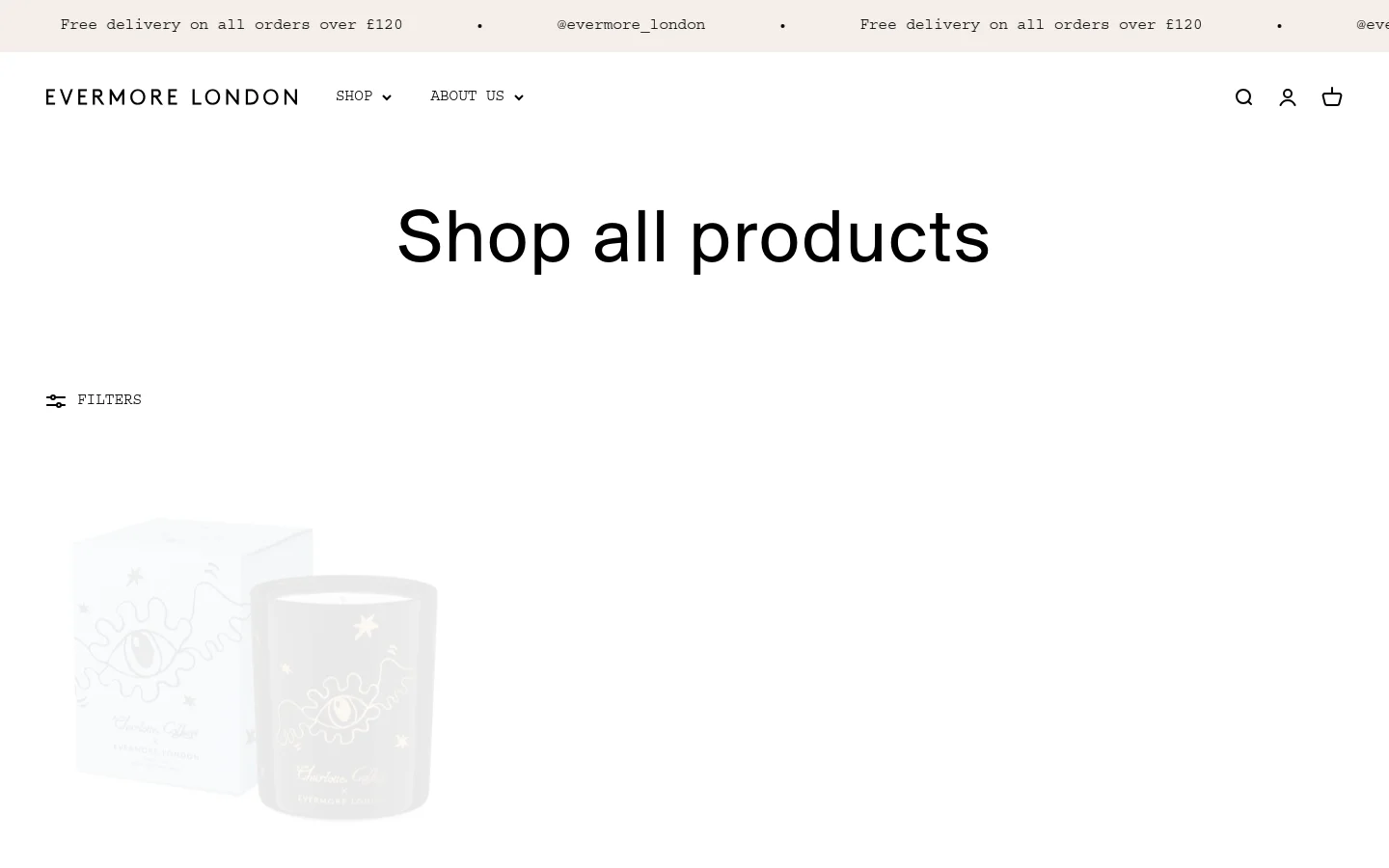 The desktop shop page features a clean, minimalist white background with the headline 'Shop all products' centered at the top. Below the header, a 'FILTERS' button sits above a grid of product images including candles, gift sets, and bundles. The navigation bar includes the Evermore London logo, shop and about us dropdowns, a search icon, a user icon, and a shopping bag icon.