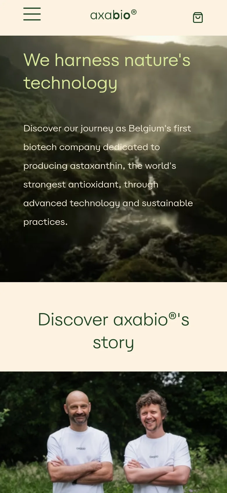 The mobile version uses a vertical layout, starting with a condensed hero section showing the misty landscape and headline. The navigation is simplified into a hamburger menu on the left and a shopping bag icon on the right, with the logo centered. Content sections, including the 'Discover axabio's story' heading and the team photo, are stacked vertically for easier scrolling.