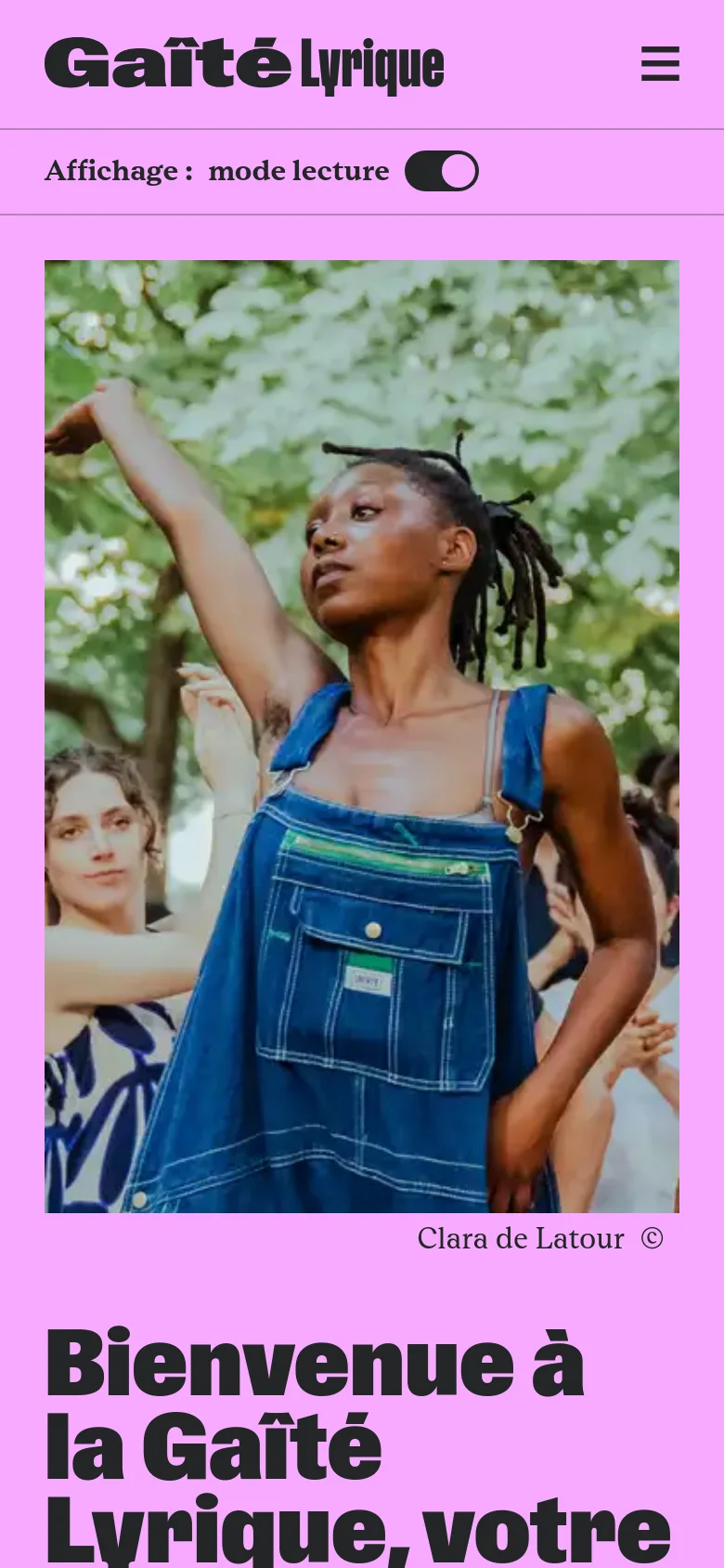 The mobile version maintains the pink background and large black typography but uses a hamburger menu icon for navigation. The hero image is cropped to a vertical orientation, focusing tightly on the central person in denim overalls, and the headline 'Bienvenue à la Gaîté Lyrique' appears below the image.