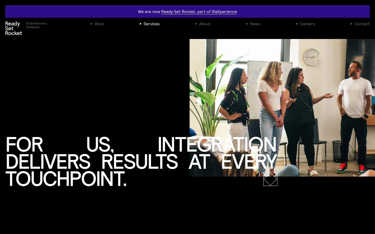 The desktop page features a dark theme with a large hero image of a professional team collaborating in a bright office. A bold headline, 'FOR US, INTEGRATION DELIVERS RESULTS AT EVERY TOUCHPOINT,' is overlaid on the left, while a navigation bar sits at the top against a purple announcement banner. Below the hero, the layout transitions to a clean white background detailing four service areas: Brand & Communication Strategy, Digital Strategy, Data & Analytics Strategy, and AI.