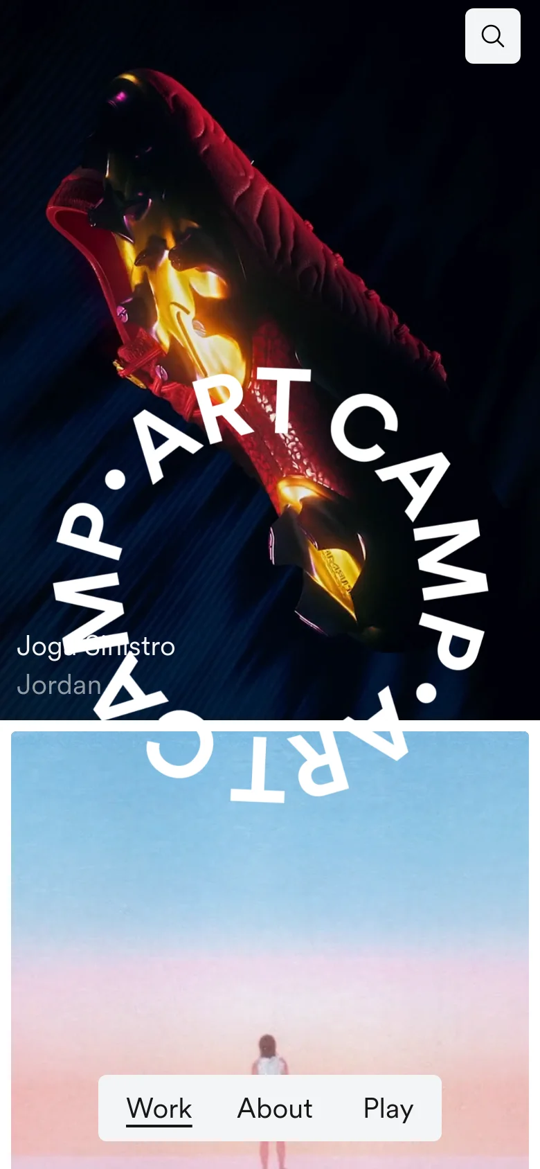 The mobile version maintains the dark aesthetic but uses a vertical layout. The circular 'ART CAMP' logo is prominently centered over a large, colorful hero image, and the navigation menu is simplified into a horizontal bar at the bottom containing 'Work', 'About', and 'Play'.