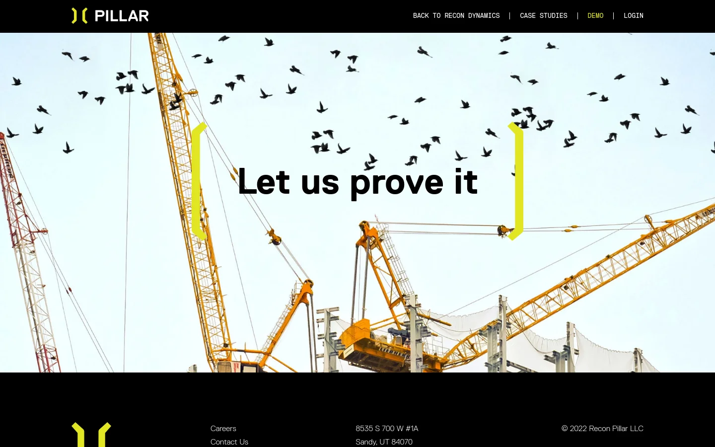 The desktop page features a black header with the Pillar logo and navigation links. The hero section shows a large image of yellow construction cranes against a sky filled with birds, overlaid with the bold text 'Let us prove it' framed by two yellow vertical brackets. A black footer contains the company logo, site links, address, and copyright information.