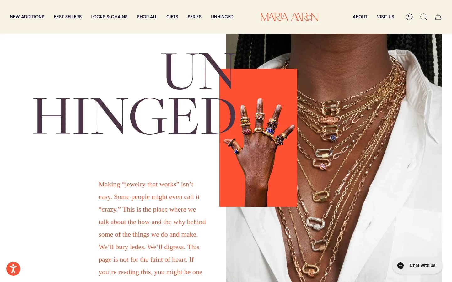 The desktop page features a split-screen hero section with large, stylized serif text reading 'UNHINGED' over a white background on the left and a close-up of a person wearing layered gold necklaces on the right. An orange rectangular inset shows a hand adorned with multiple rings. The navigation bar is clean with a centered logo and links for jewelry collections.