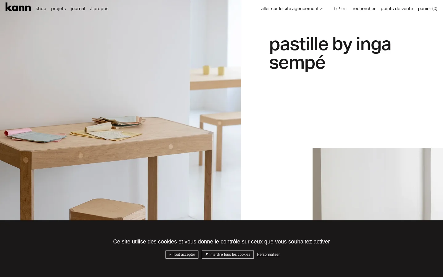 The desktop homepage features a minimalist design with a large hero image of a light wood desk and stool against a white background. To the right, the headline 'pastille by inga sempé' is displayed in large black lowercase text. A navigation menu is at the top, and a black cookie consent banner spans the bottom.