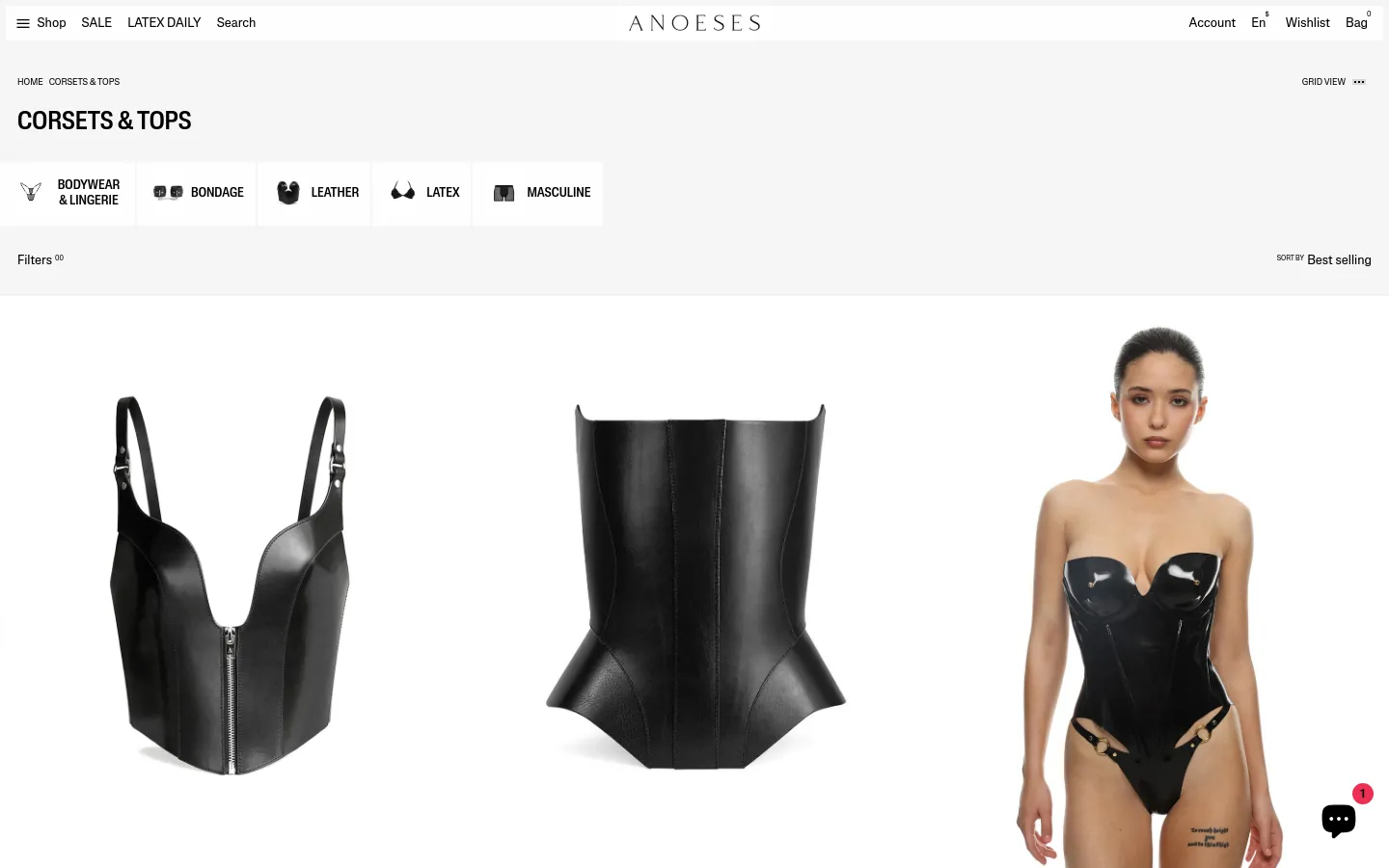 The desktop page for Corsets & Tops features a minimalist white layout with a top navigation bar and category tiles for Bodywear, Bondage, Leather, Latex, and Masculine. Below the categories, a product grid displays high-quality images of black leather and latex corsets with titles and prices. Large, high-resolution product photography dominates the view, showcasing detailed textures of the garments.