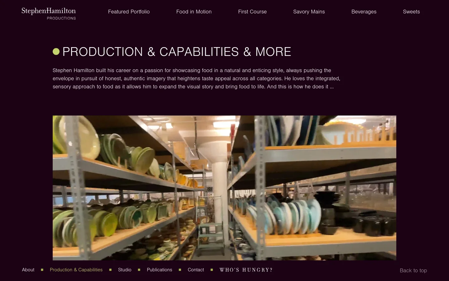 The desktop version features a dark, minimalist layout with a top navigation menu including links like Featured Portfolio and Food in Motion. A large headline reads 'PRODUCTION & CAPABILITIES & MORE' above an introductory paragraph, followed by a wide hero image showing shelves of colorful ceramic plates in a studio setting. The footer contains site navigation and a 'Back to top' link.