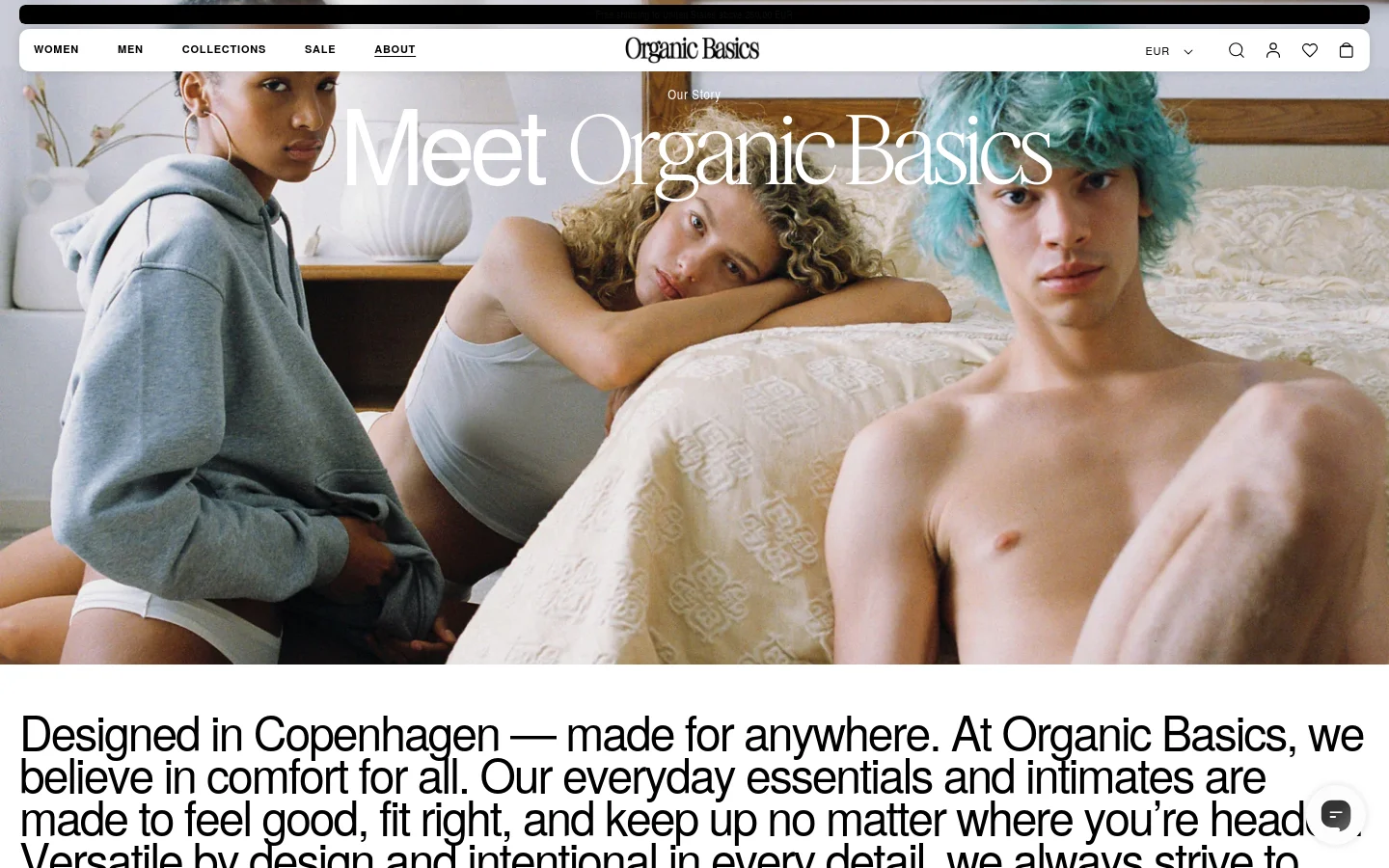 The desktop version features a wide hero image of three models lounging on a bed, with the headline 'Meet Organic Basics' overlaid in white serif text. Below the image, a large heading introduces the brand's mission, set against a clean white background with a navigation bar at the top containing links for Women, Men, Collections, Sale, and About. The layout is spacious and minimalist, using a neutral color palette.