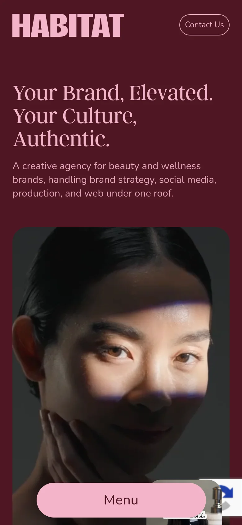 The mobile version uses a similar burgundy color scheme and white serif text but adopts a vertical stack layout. The hero headline is centered and takes up more screen space, while the navigation is condensed into a large, light pink 'Menu' button at the bottom of the screen. The primary 'Contact Us' button is positioned at the top right.