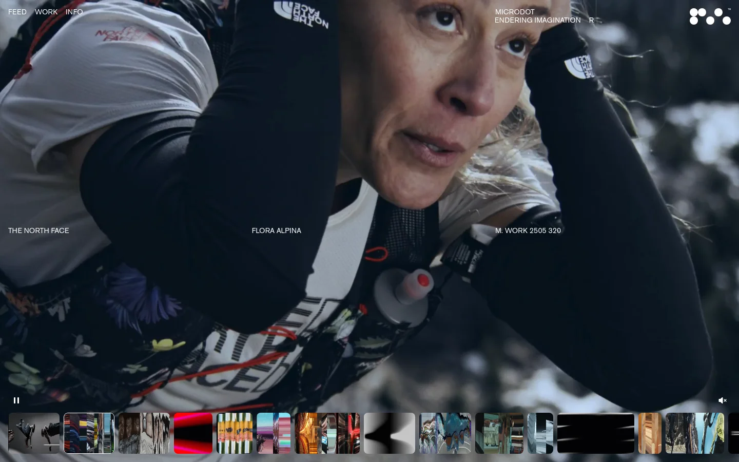 The Microdot homepage features a minimalist dark design with a large, full-screen video hero background showing a close-up of an athlete. Navigation links for Feed, Work, and Info are in the top left, while the brand name and a decorative dot logo are in the top right. A filmstrip of video thumbnails runs along the bottom of the screen.