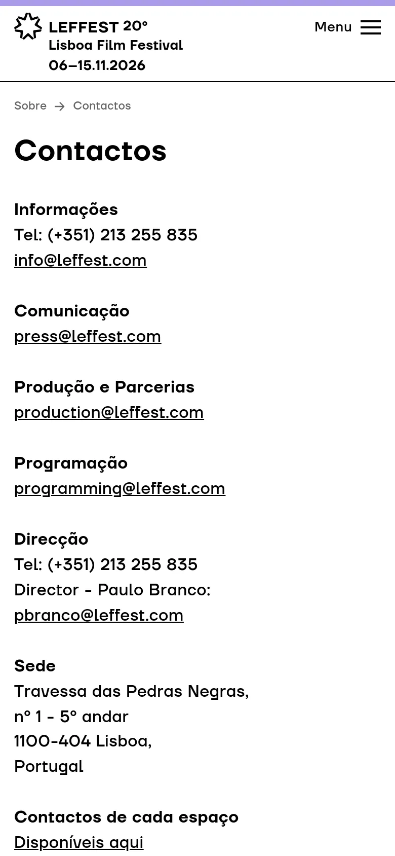 The mobile version maintains the minimalist white and black aesthetic but uses a condensed layout. The top navigation is replaced by a hamburger menu icon labeled 'Menu' next to the festival logo. The contact categories and information are stacked vertically in a single column for easy scrolling on a narrow screen.