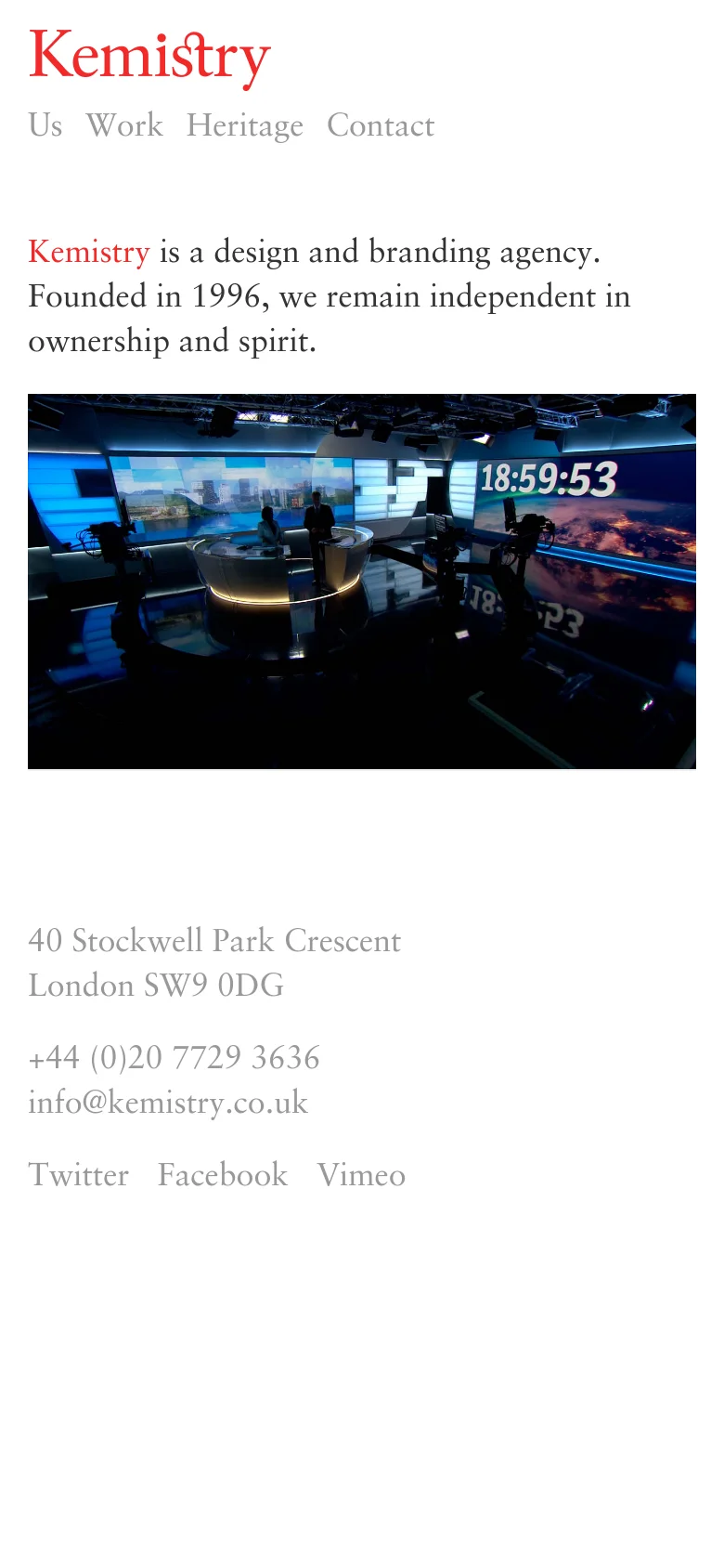 The mobile version uses a stacked layout with the red Kemistry logo centered at the top, followed by a horizontal navigation menu. The introductory text and large news studio hero image are centered, and the contact information is displayed in a single column at the bottom of the page.
