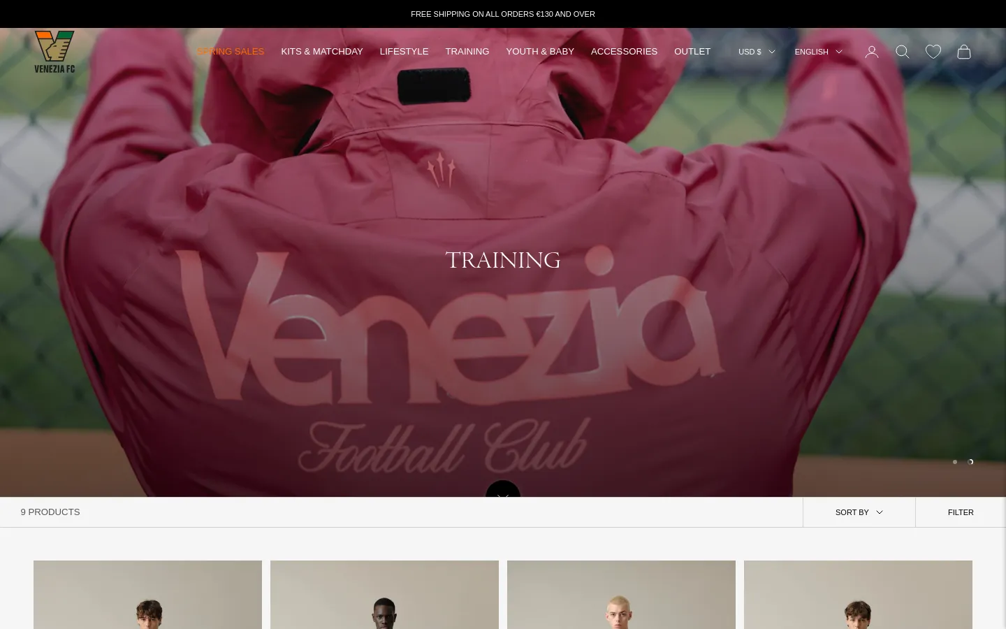 The desktop page features a large hero image of a person in a pink Venezia training jacket with the word 'TRAINING' centered in white. Below the hero section, a product grid displays training apparel with options to filter and sort. The layout is clean with a white background for the product section and a navigation bar at the top.