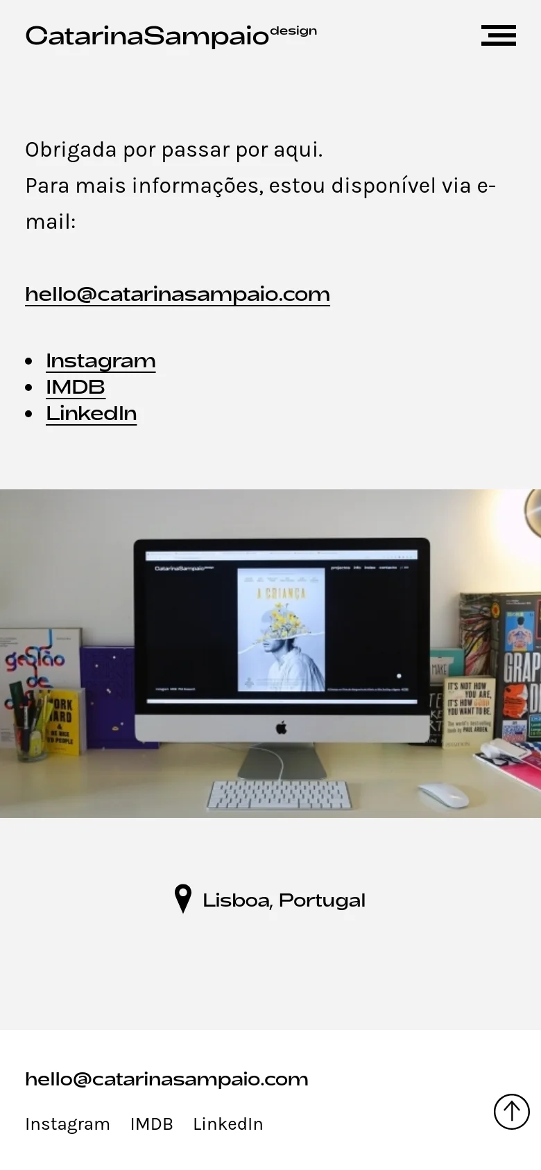 The mobile version uses a single-column layout with a hamburger menu icon in the top right. The contact information and social links are stacked vertically above a large hero image of a desk setup, followed by the location 'Lisboa, Portugal' and a footer with the email and social links.