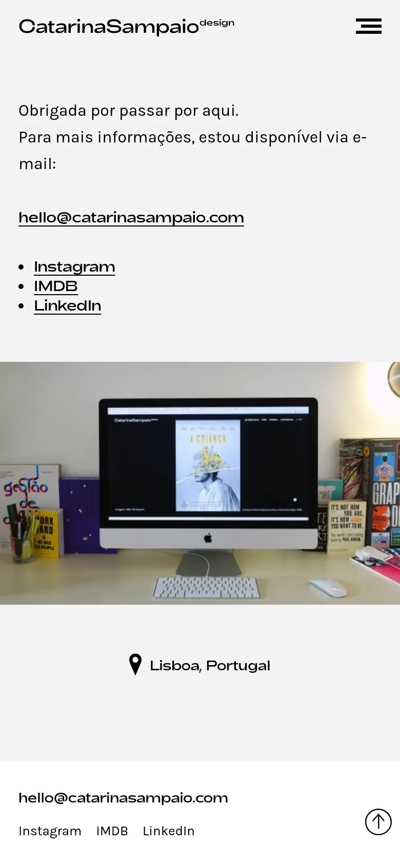 The mobile version uses a single-column layout with a hamburger menu icon in the top right. The contact information and social links are stacked vertically above a large hero image of a desk setup, followed by the location 'Lisboa, Portugal' and a footer with the email and social links.