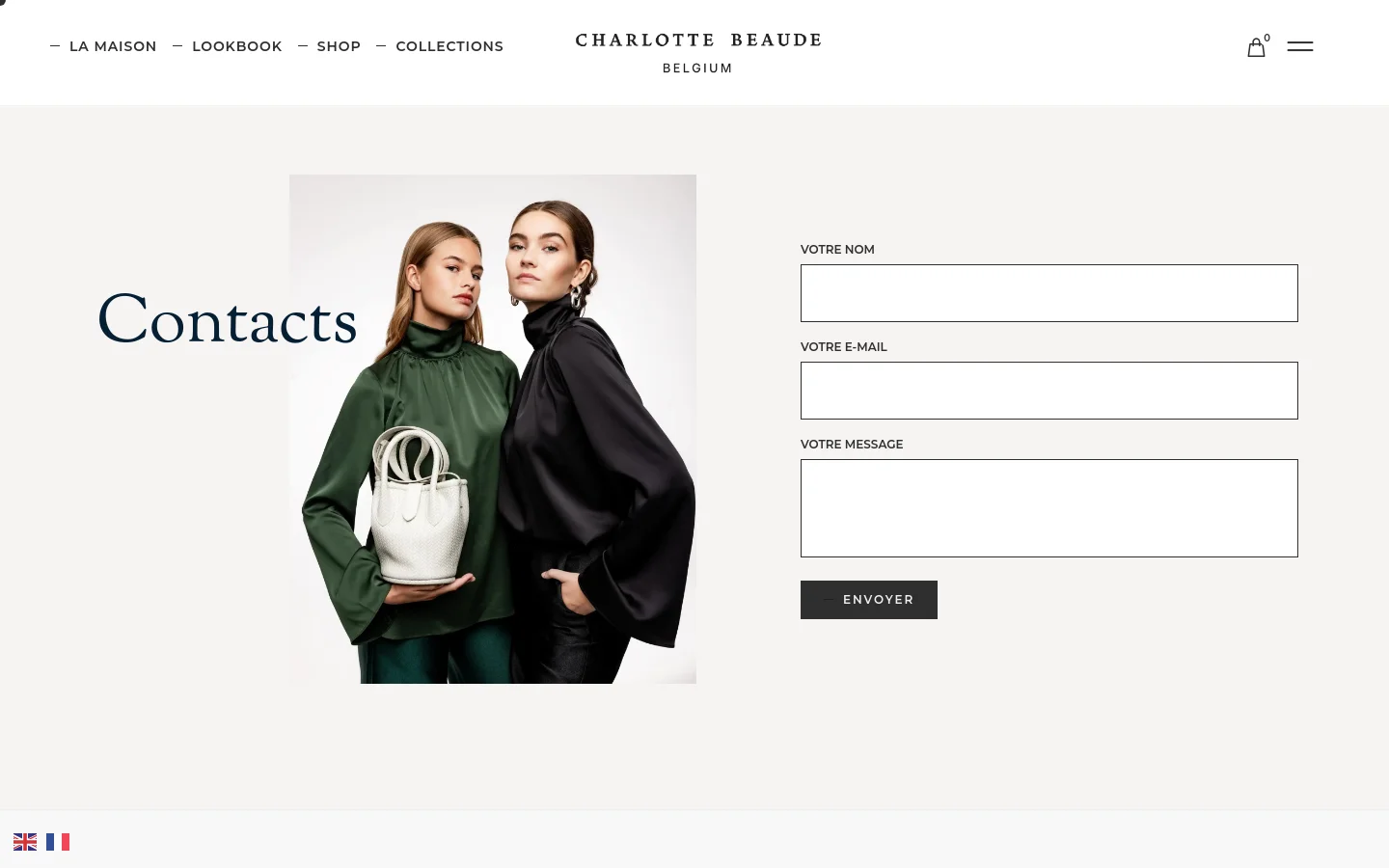 The desktop contact page features a minimalist layout with a large 'Contacts' heading on the left and a contact form on the right. A central vertical image shows two models in elegant dark green and black silk clothing, one holding a white handbag. The navigation menu is at the top with links for La Maison, Lookbook, Shop, and Collections against a light grey background.