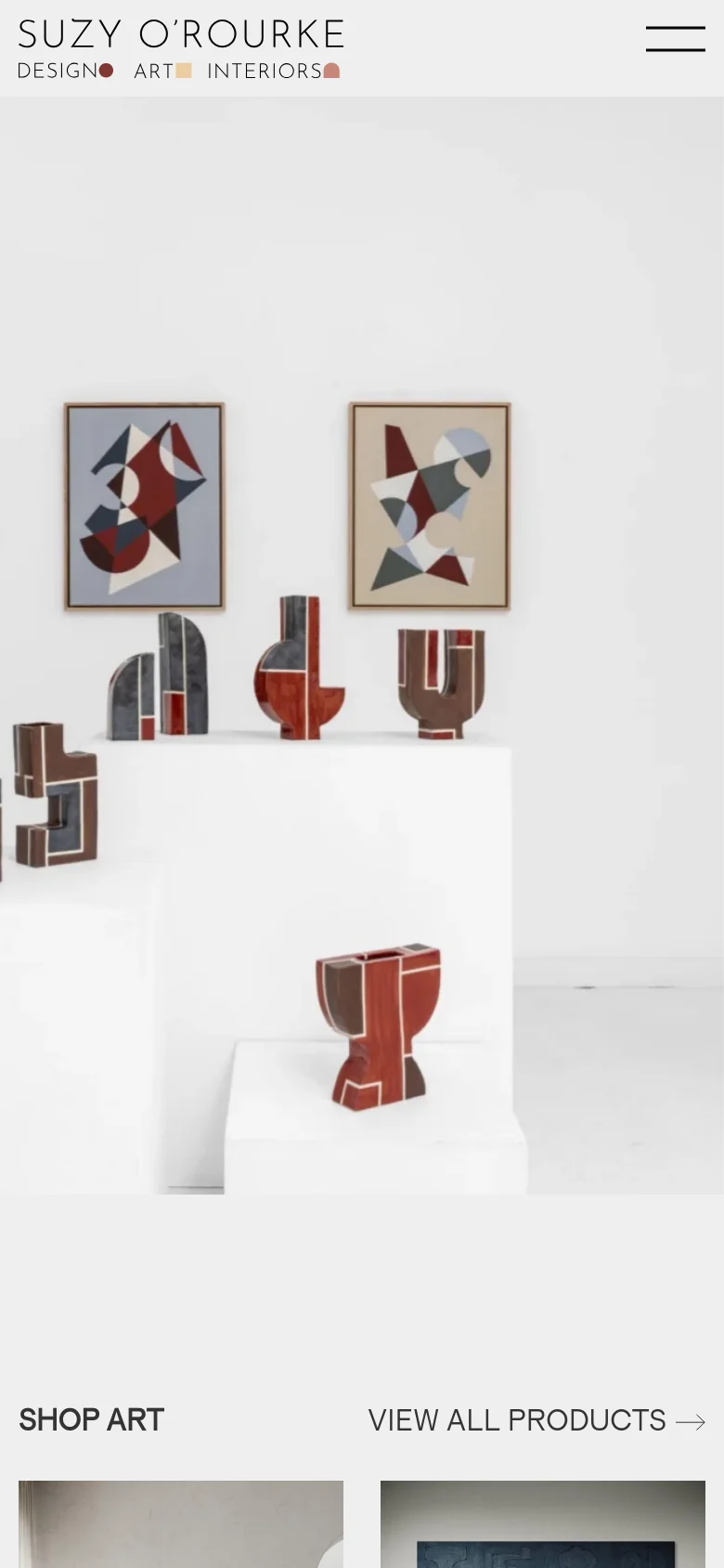 The mobile version uses a simplified layout with a hamburger menu icon in the top right and the brand logo centered. The large hero image of abstract art and ceramics spans the width of the screen, followed by a single-column vertical scroll of product categories and items.